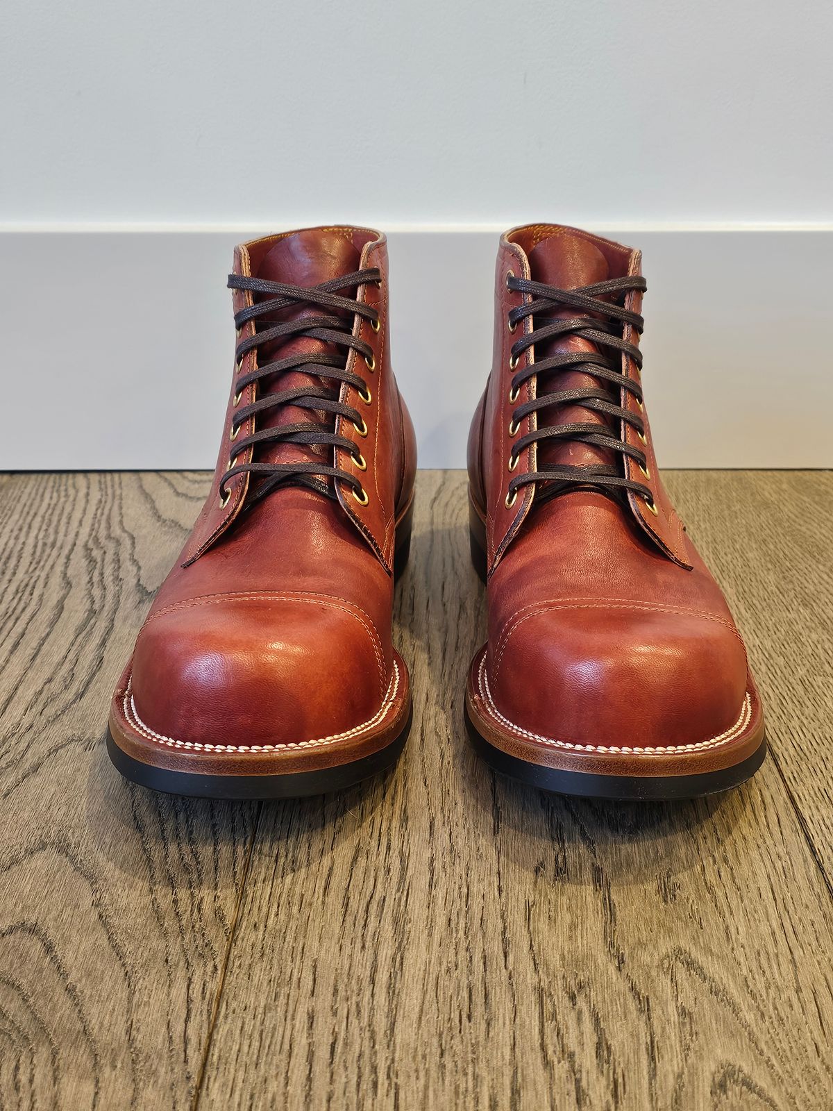 Photo by cgbaird2 on November 6, 2024 of the Iron Boots Pitman in Maryam Brick Red Hand-Dyed Horsehide.