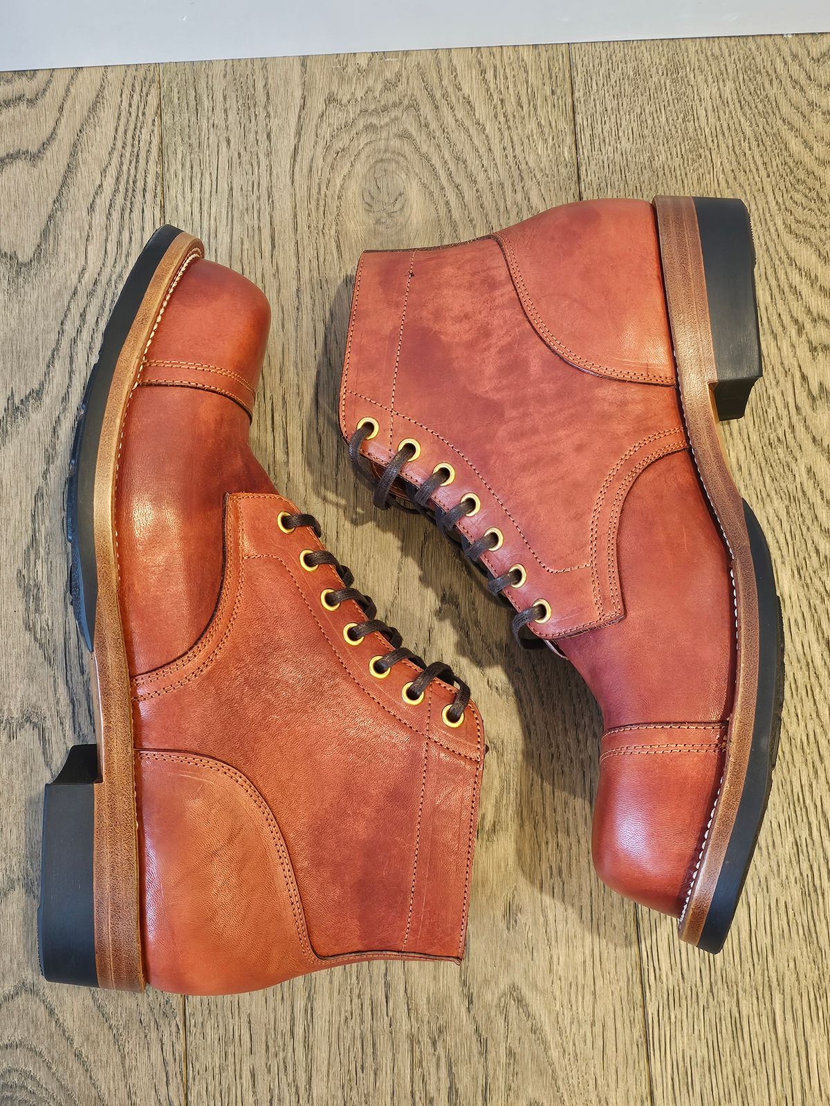 Photo by cgbaird2 on November 6, 2024 of the Iron Boots Pitman in Maryam Brick Red Hand-Dyed Horsehide.