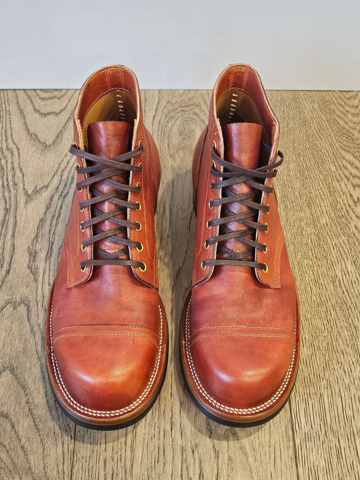 Photo by cgbaird2 on November 6, 2024 of the Iron Boots Pitman in Maryam Brick Red Hand-Dyed Horsehide.