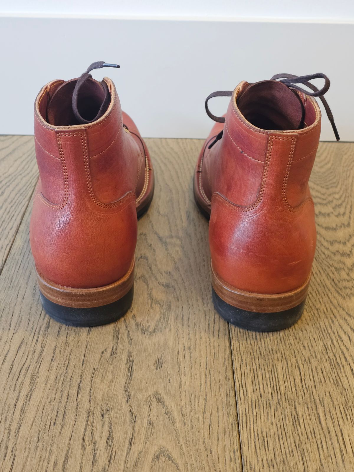 Photo by cgbaird2 on December 5, 2024 of the Iron Boots Pitman in Maryam Brick Red Hand-Dyed Horsehide.