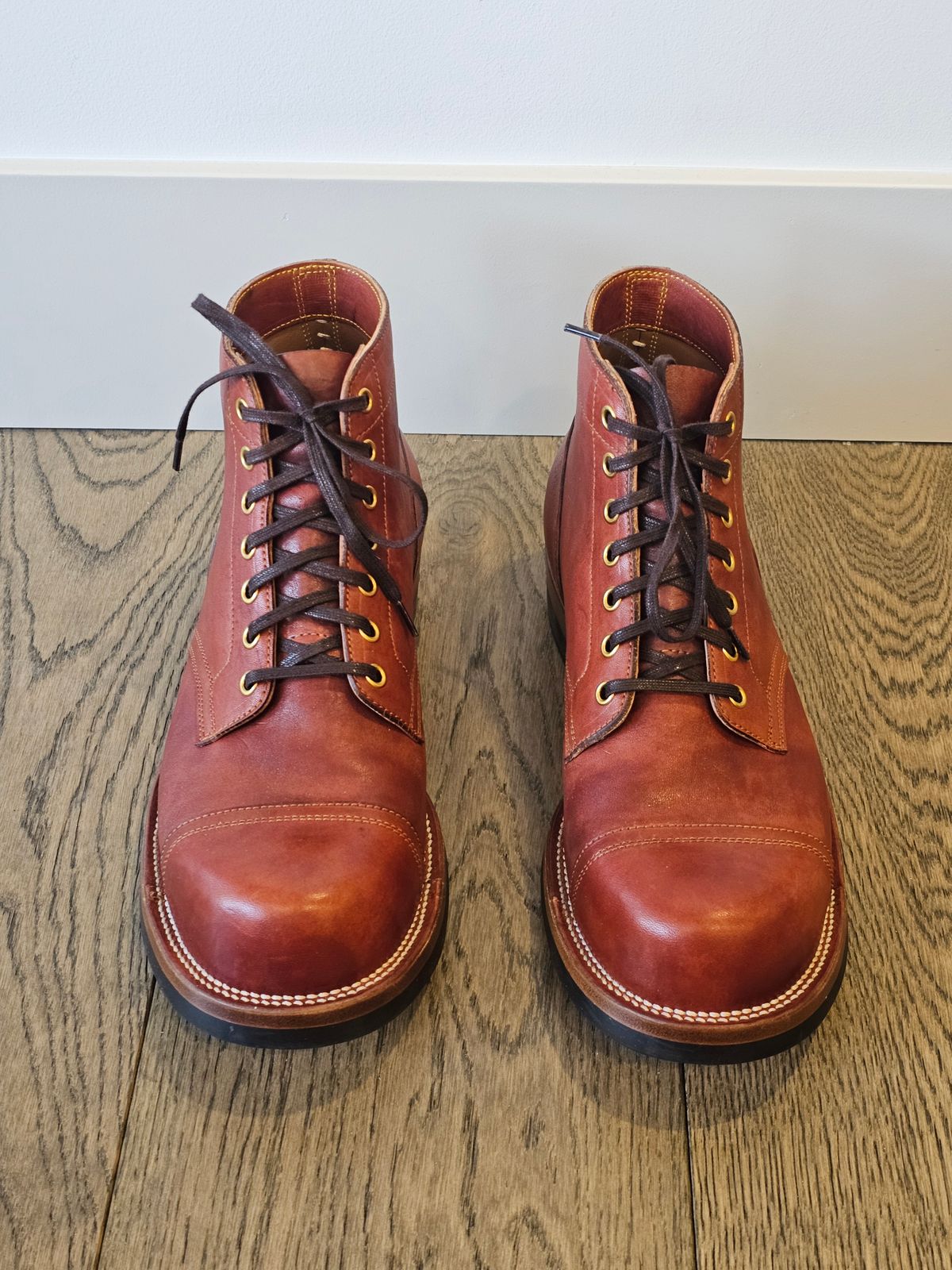 Photo by cgbaird2 on December 5, 2024 of the Iron Boots Pitman in Maryam Brick Red Hand-Dyed Horsehide.