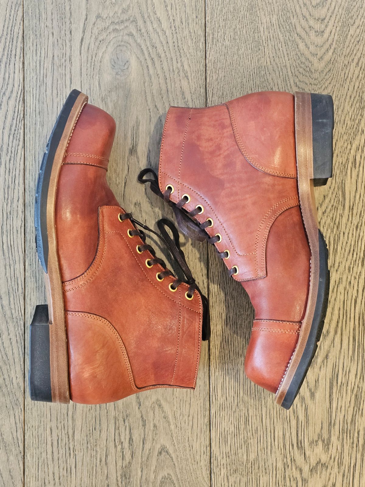 Photo by cgbaird2 on December 5, 2024 of the Iron Boots Pitman in Maryam Brick Red Hand-Dyed Horsehide.