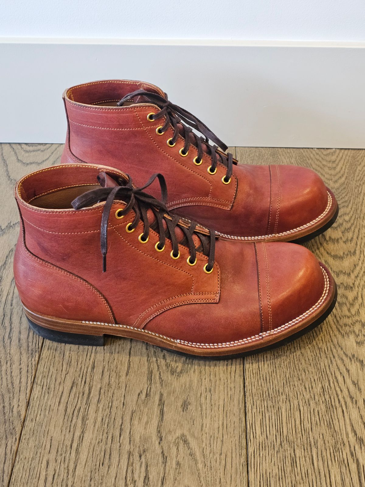 Photo by cgbaird2 on December 5, 2024 of the Iron Boots Pitman in Maryam Brick Red Hand-Dyed Horsehide.