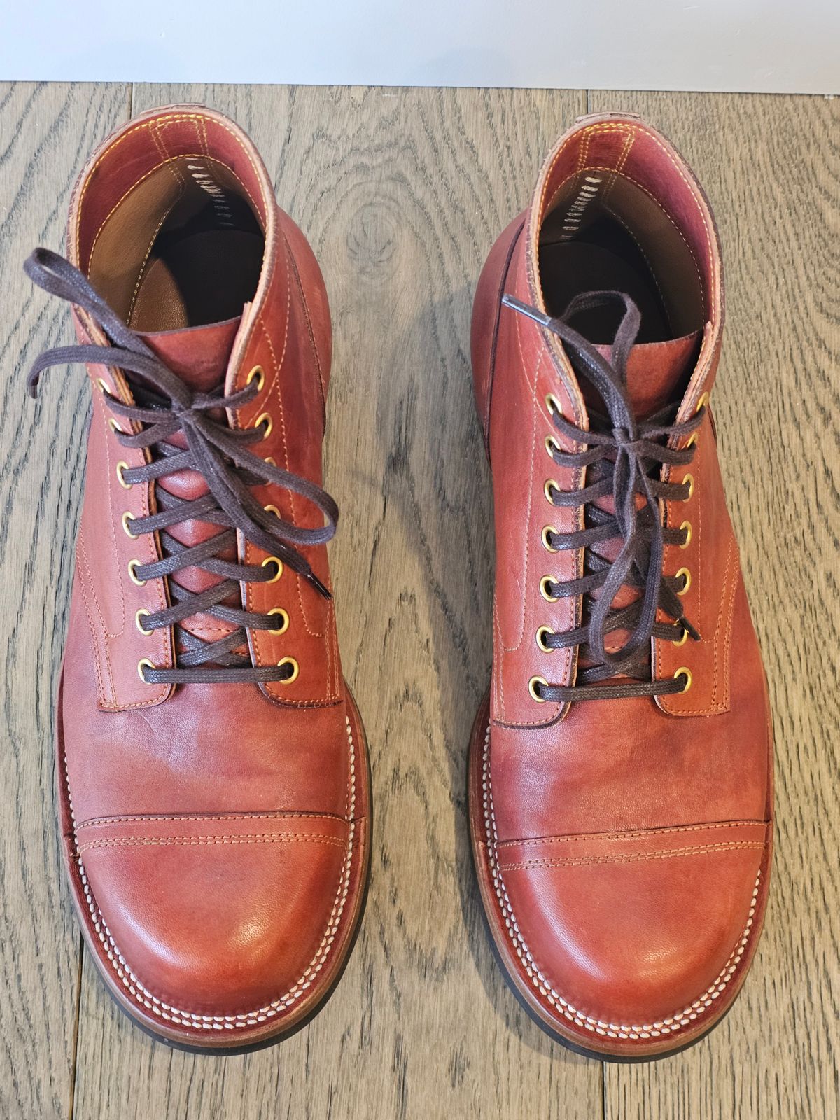 Photo by cgbaird2 on December 5, 2024 of the Iron Boots Pitman in Maryam Brick Red Hand-Dyed Horsehide.