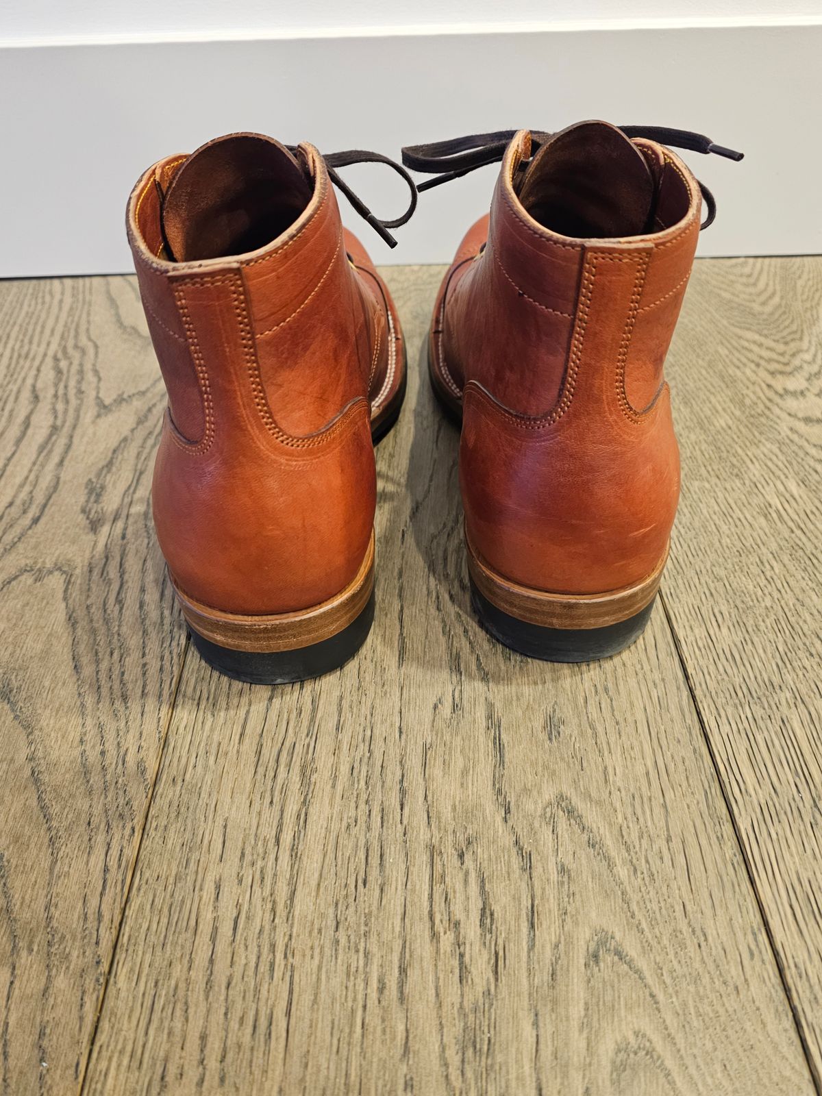 Photo by cgbaird2 on January 5, 2025 of the Iron Boots Pitman in Maryam Brick Red Hand-Dyed Horsehide.