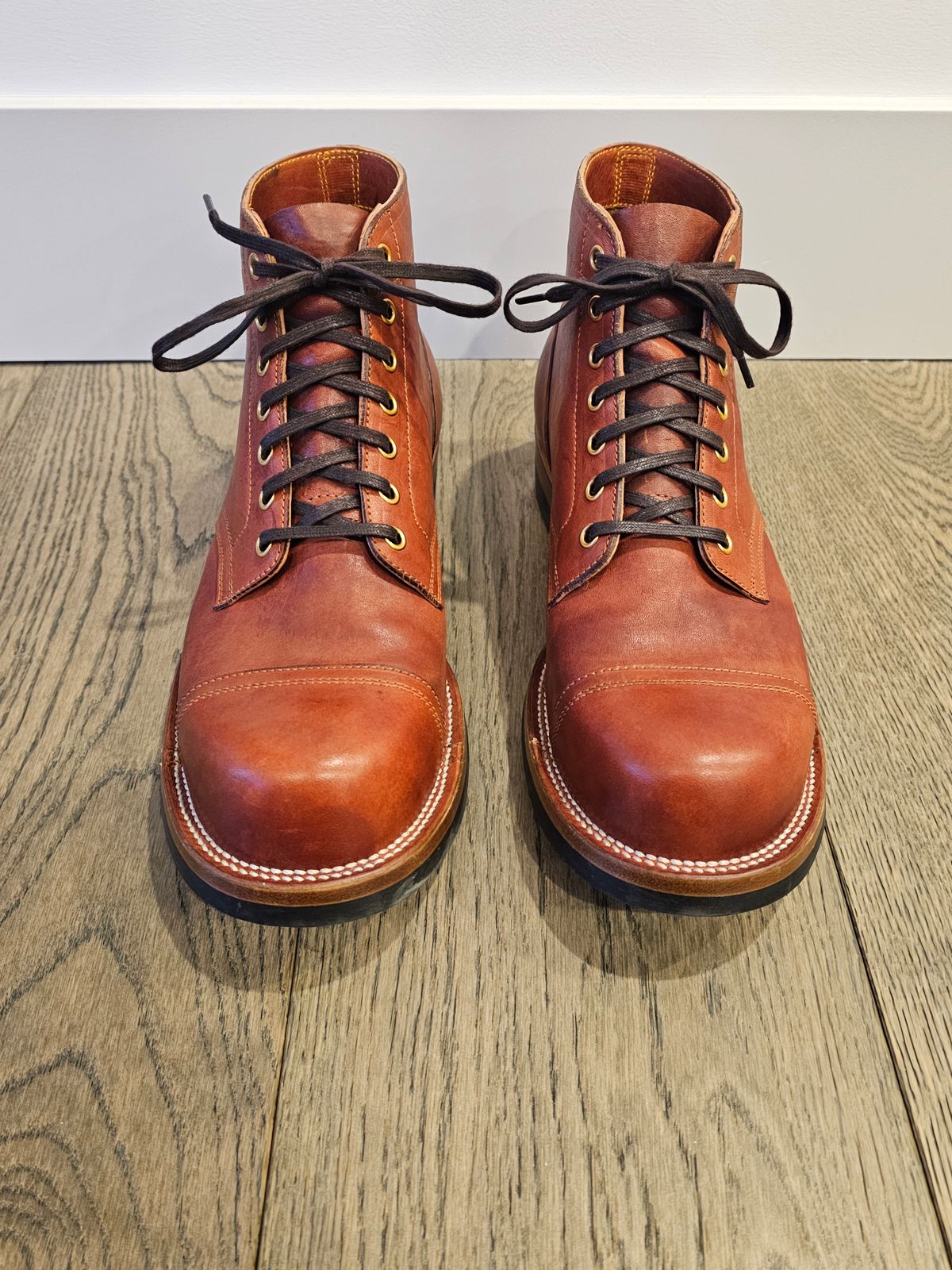 Photo by cgbaird2 on January 5, 2025 of the Iron Boots Pitman in Maryam Brick Red Hand-Dyed Horsehide.