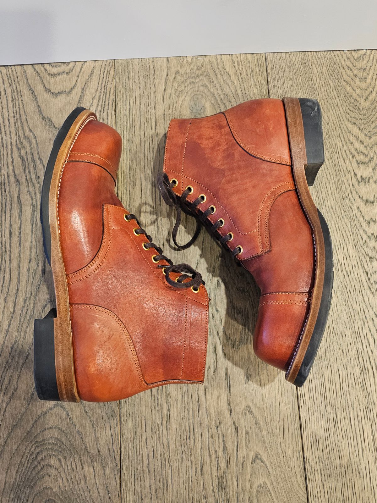 Photo by cgbaird2 on January 5, 2025 of the Iron Boots Pitman in Maryam Brick Red Hand-Dyed Horsehide.