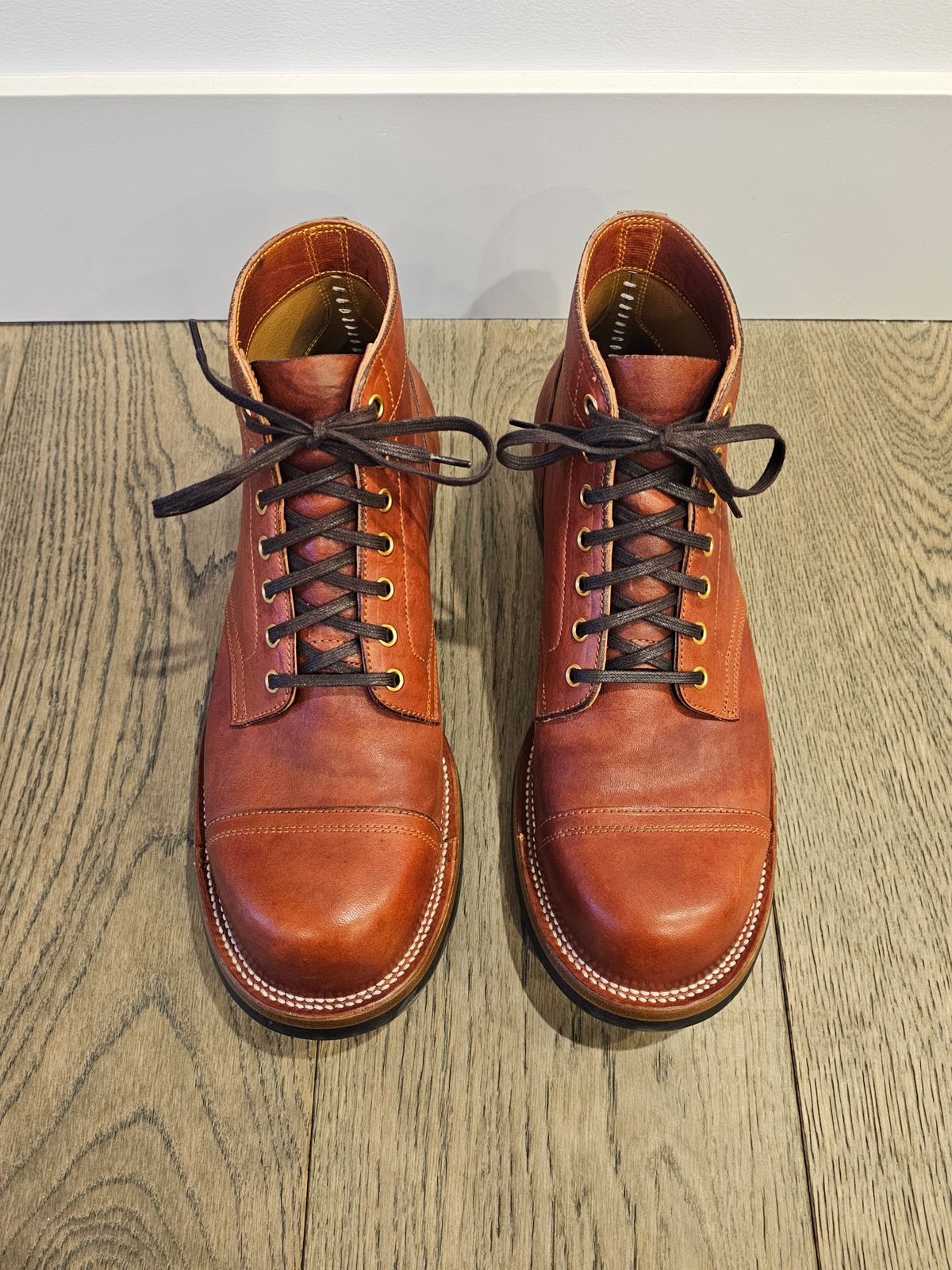 Photo by cgbaird2 on January 5, 2025 of the Iron Boots Pitman in Maryam Brick Red Hand-Dyed Horsehide.