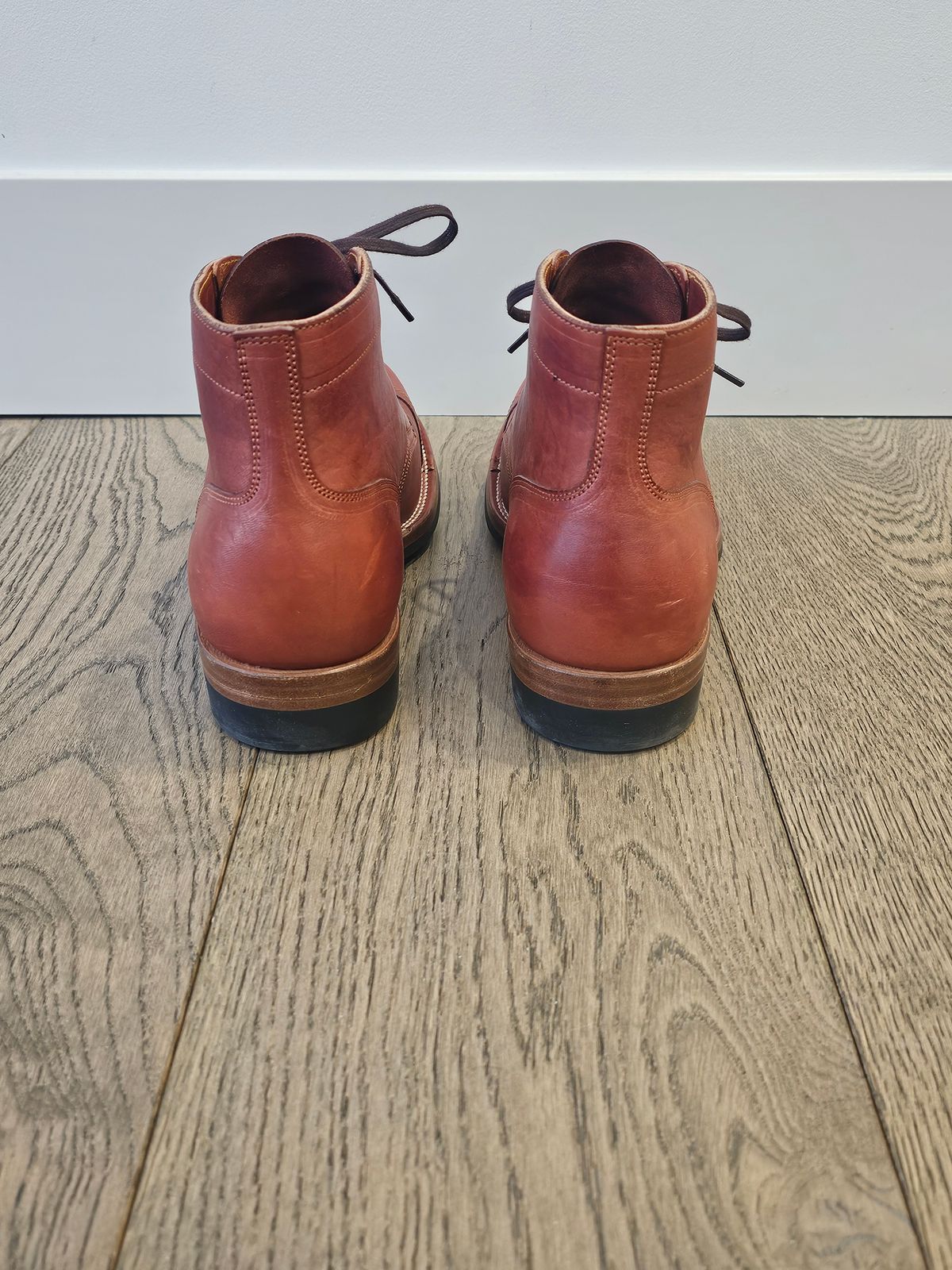 Photo by cgbaird2 on February 4, 2025 of the Iron Boots Pitman in Maryam Brick Red Hand-Dyed Horsehide.