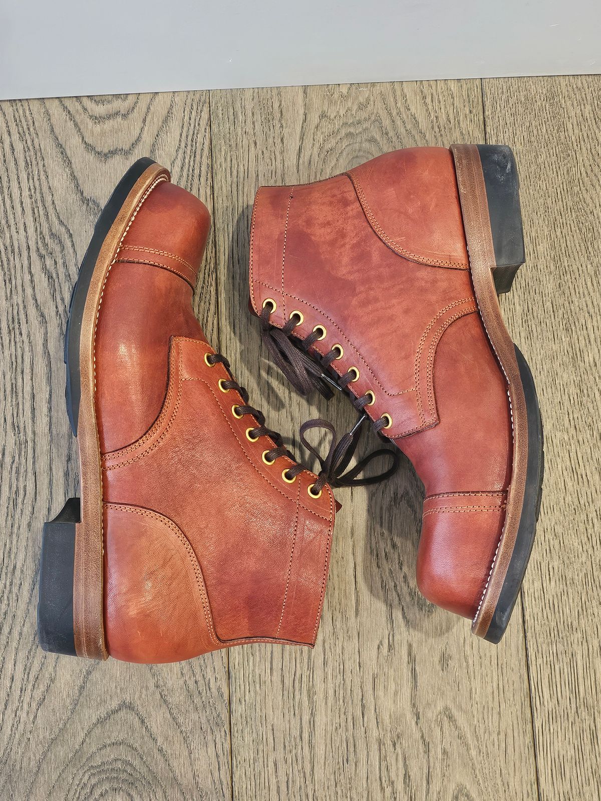 Photo by cgbaird2 on February 4, 2025 of the Iron Boots Pitman in Maryam Brick Red Hand-Dyed Horsehide.