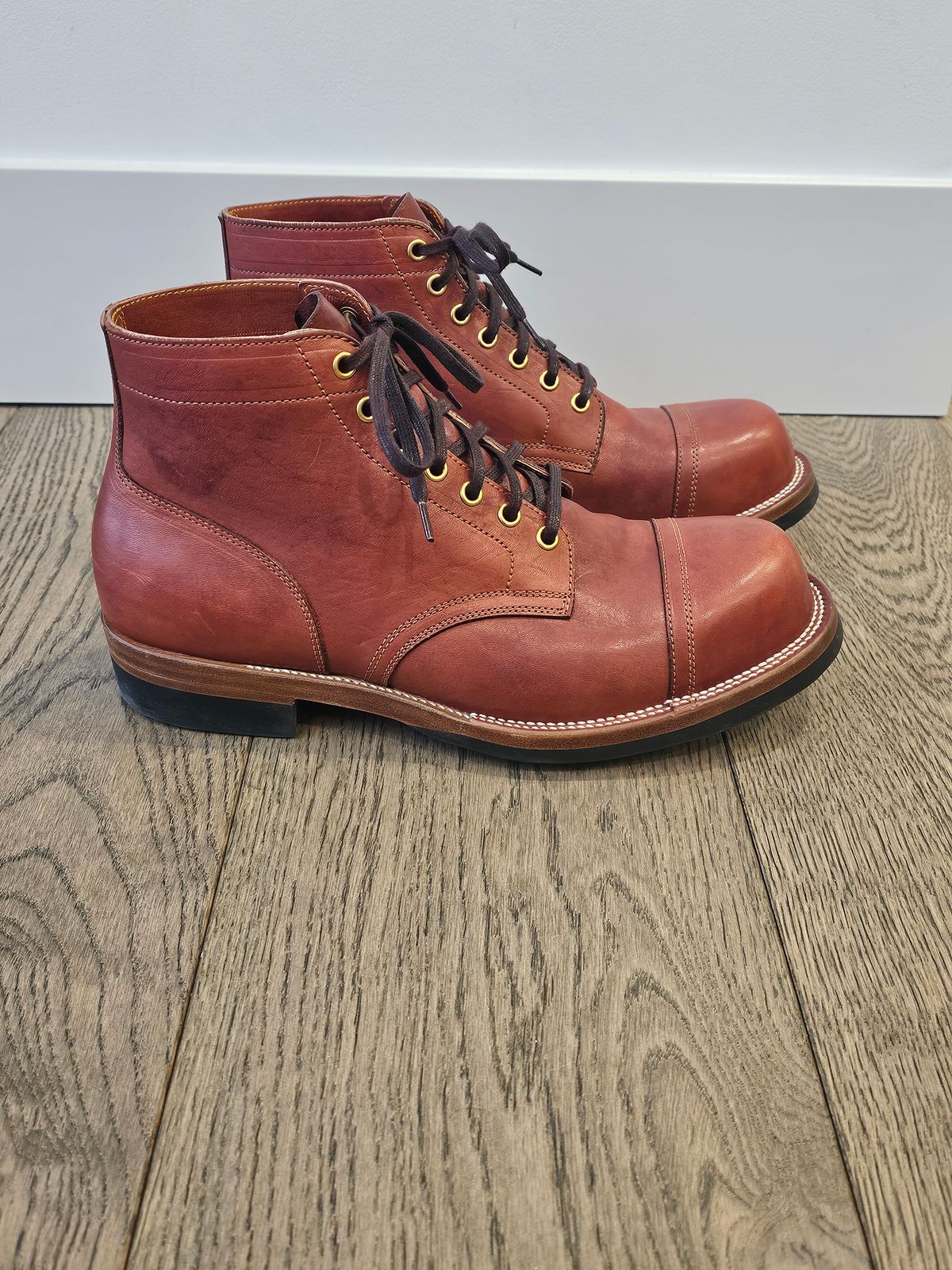 Photo by cgbaird2 on February 4, 2025 of the Iron Boots Pitman in Maryam Brick Red Hand-Dyed Horsehide.