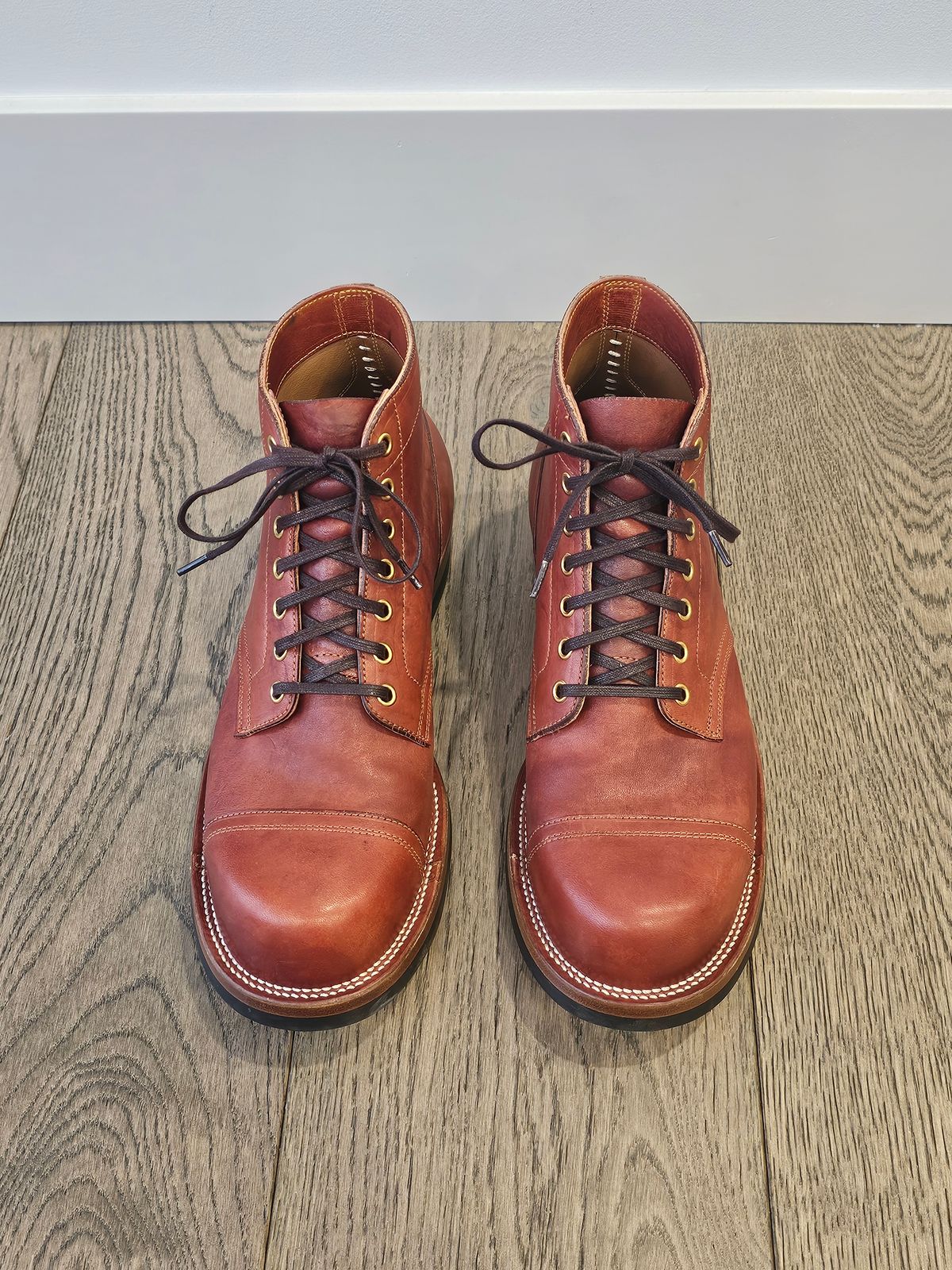 Photo by cgbaird2 on February 4, 2025 of the Iron Boots Pitman in Maryam Brick Red Hand-Dyed Horsehide.