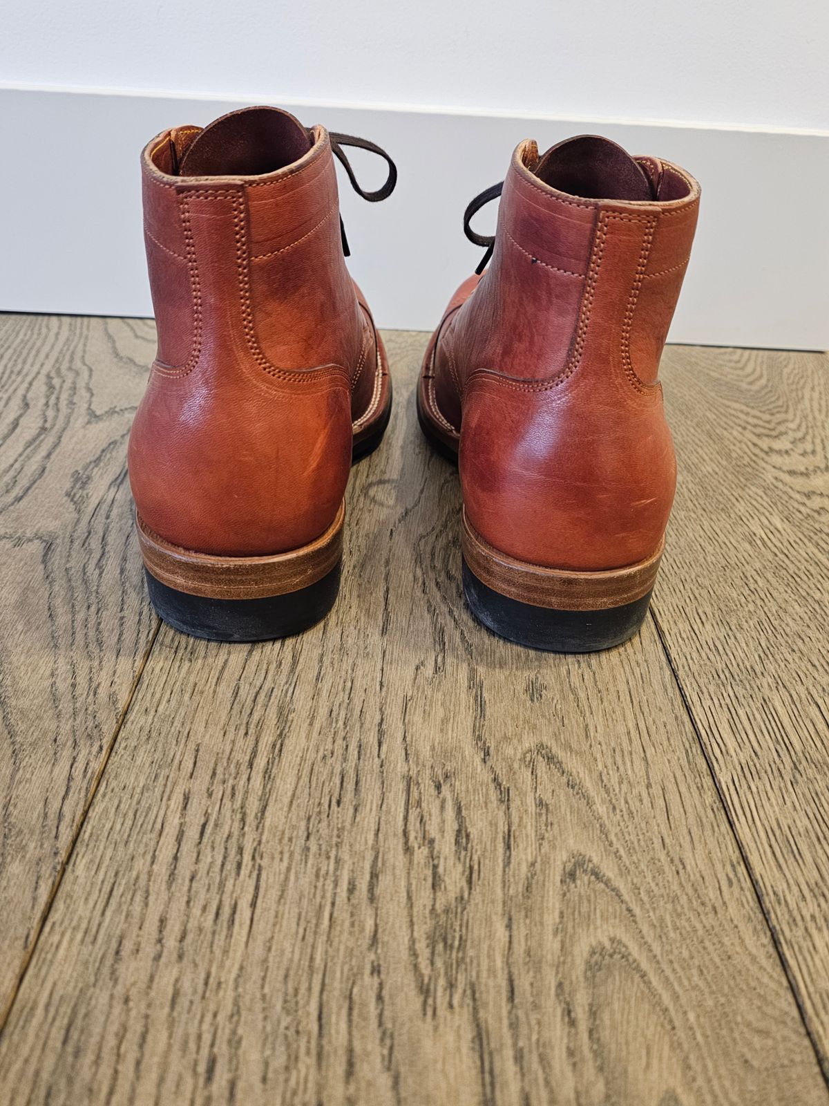 Photo by cgbaird2 on March 4, 2025 of the Iron Boots Pitman in Maryam Brick Red Hand-Dyed Horsehide.