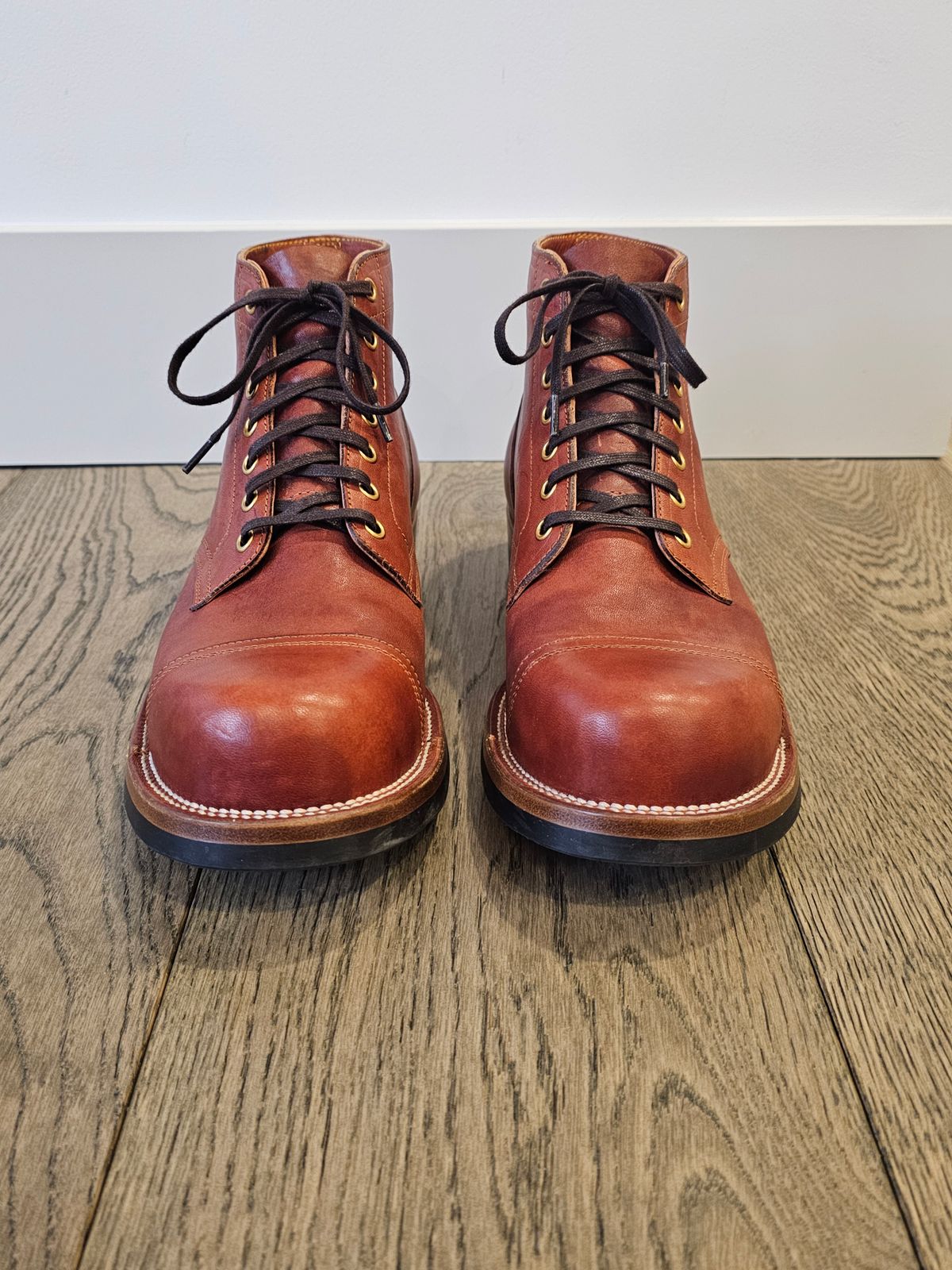 Photo by cgbaird2 on March 4, 2025 of the Iron Boots Pitman in Maryam Brick Red Hand-Dyed Horsehide.