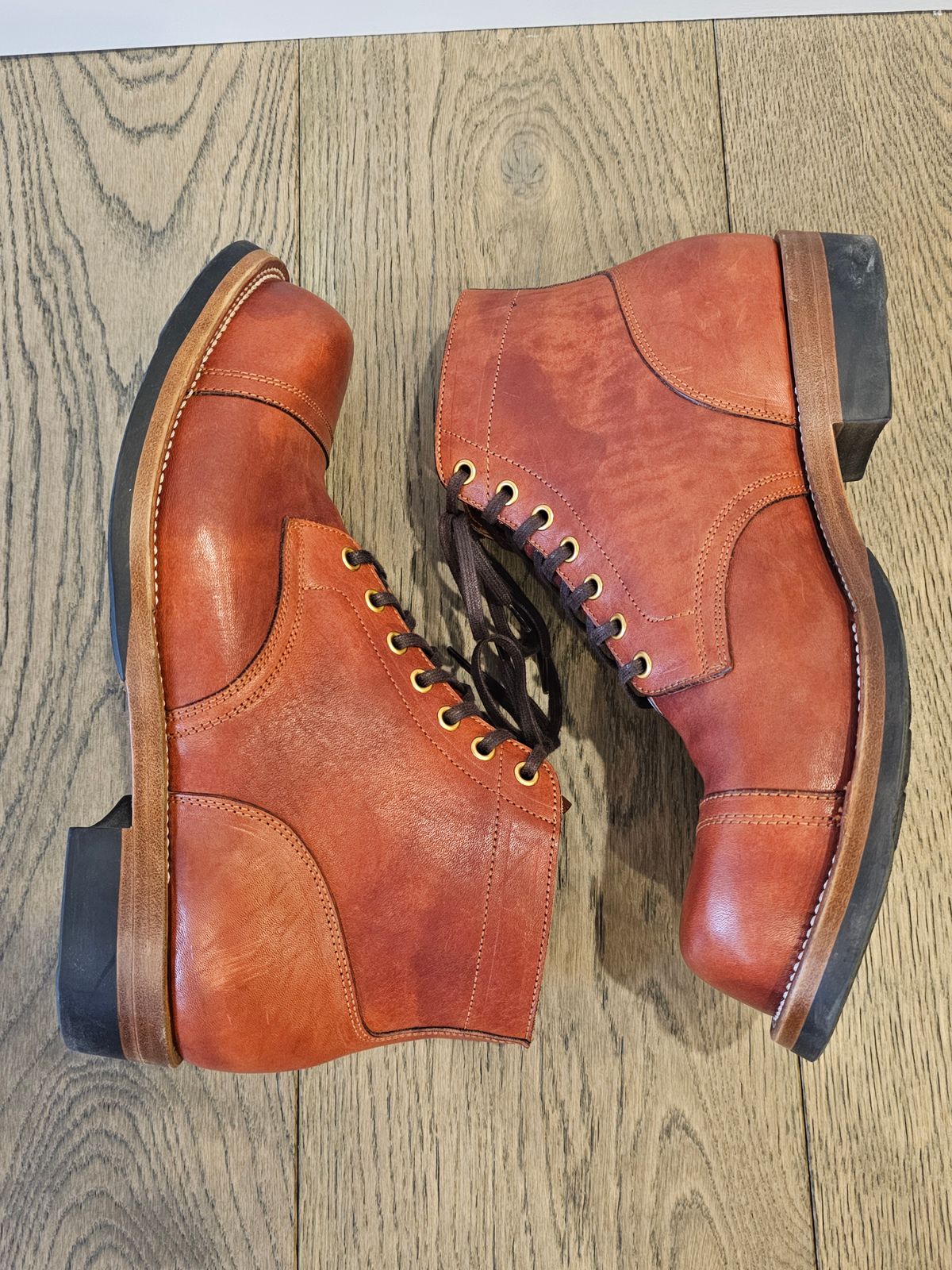 Photo by cgbaird2 on March 4, 2025 of the Iron Boots Pitman in Maryam Brick Red Hand-Dyed Horsehide.