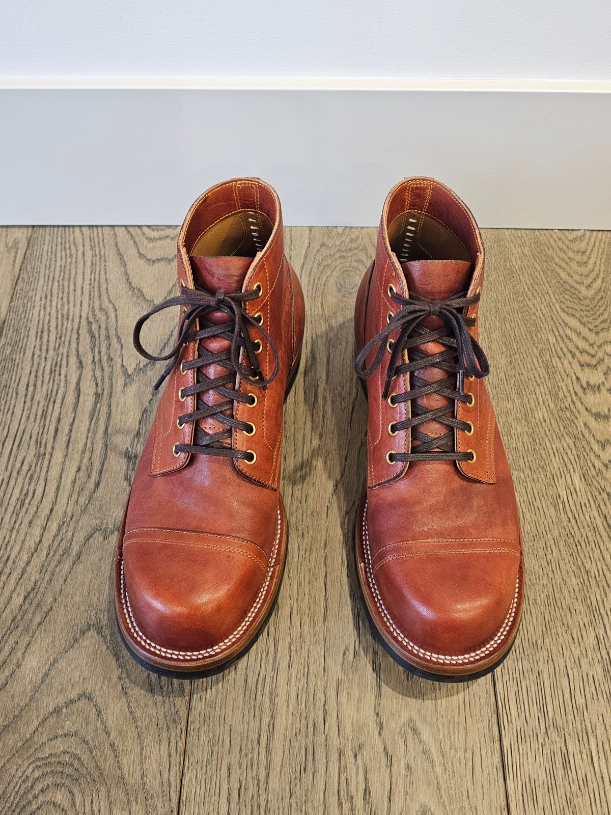 Photo by cgbaird2 on March 4, 2025 of the Iron Boots Pitman in Maryam Brick Red Hand-Dyed Horsehide.