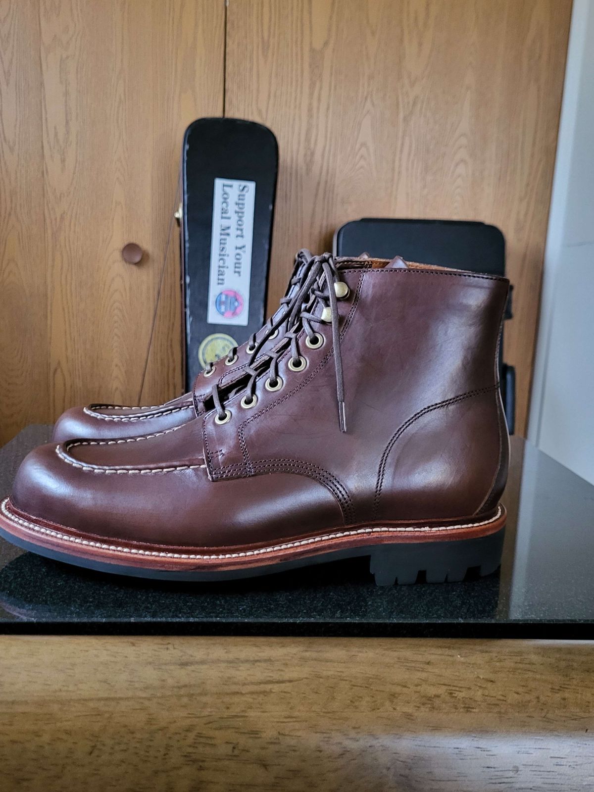 Photo by Mysterium on November 5, 2023 of the Grant Stone Brass Boot in Horween Crimson Chromexcel.