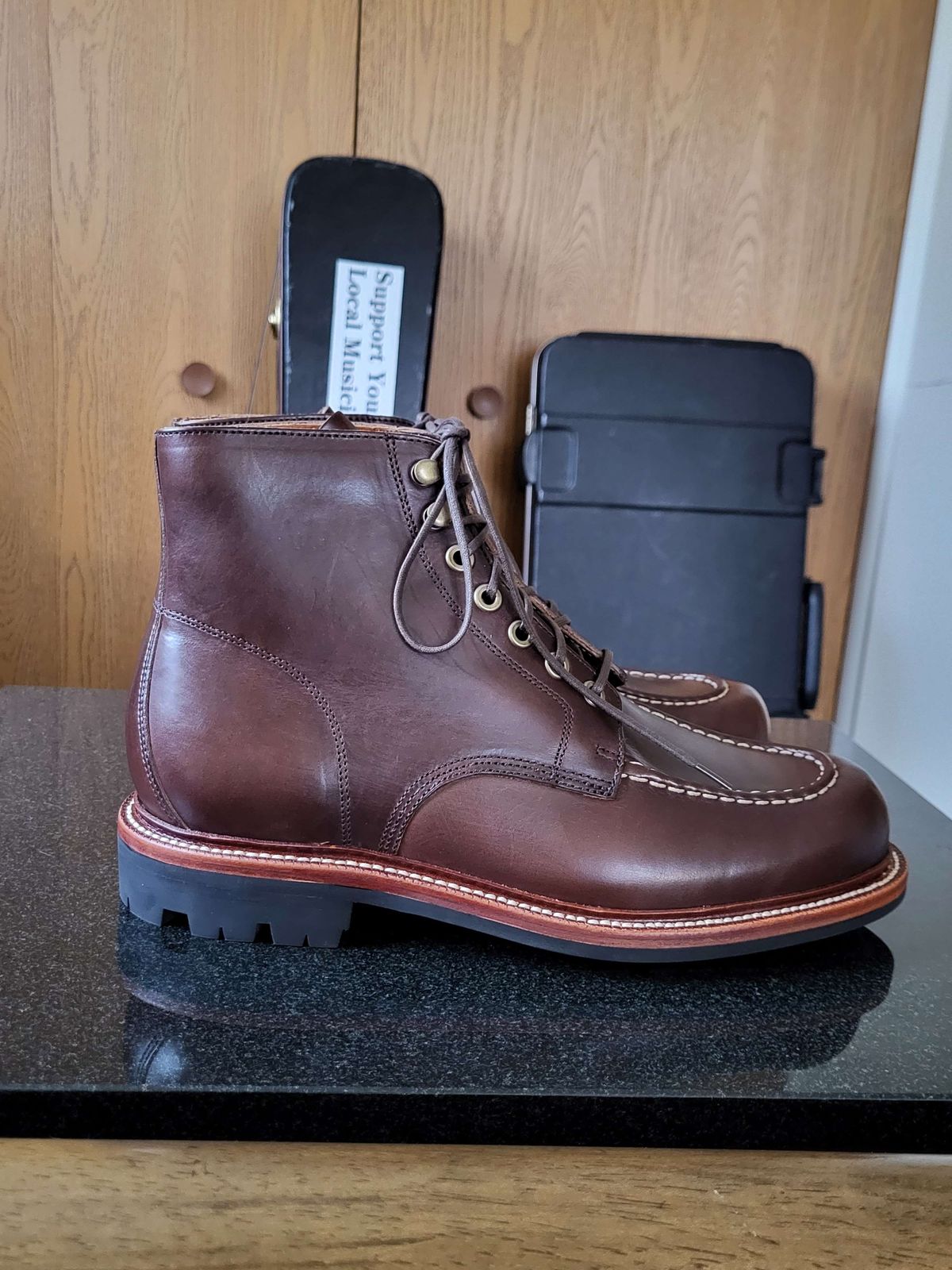 Photo by Mysterium on November 5, 2023 of the Grant Stone Brass Boot in Horween Crimson Chromexcel.
