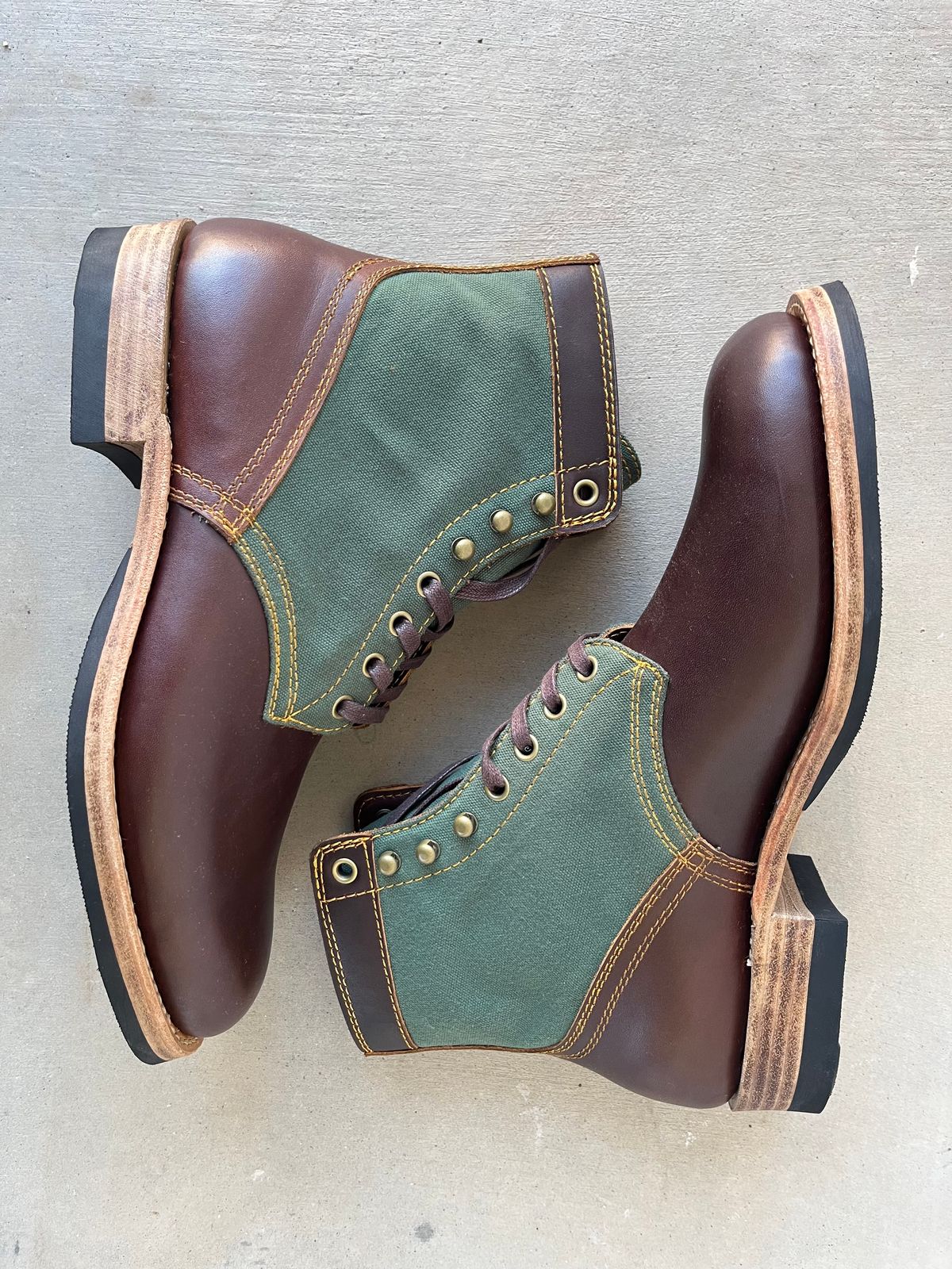 Photo by udi on November 5, 2024 of the Akito Trooper Boots in Veg-tanned, Vintage Brown Hand Finished/12oz Army Green Duck Canvas.