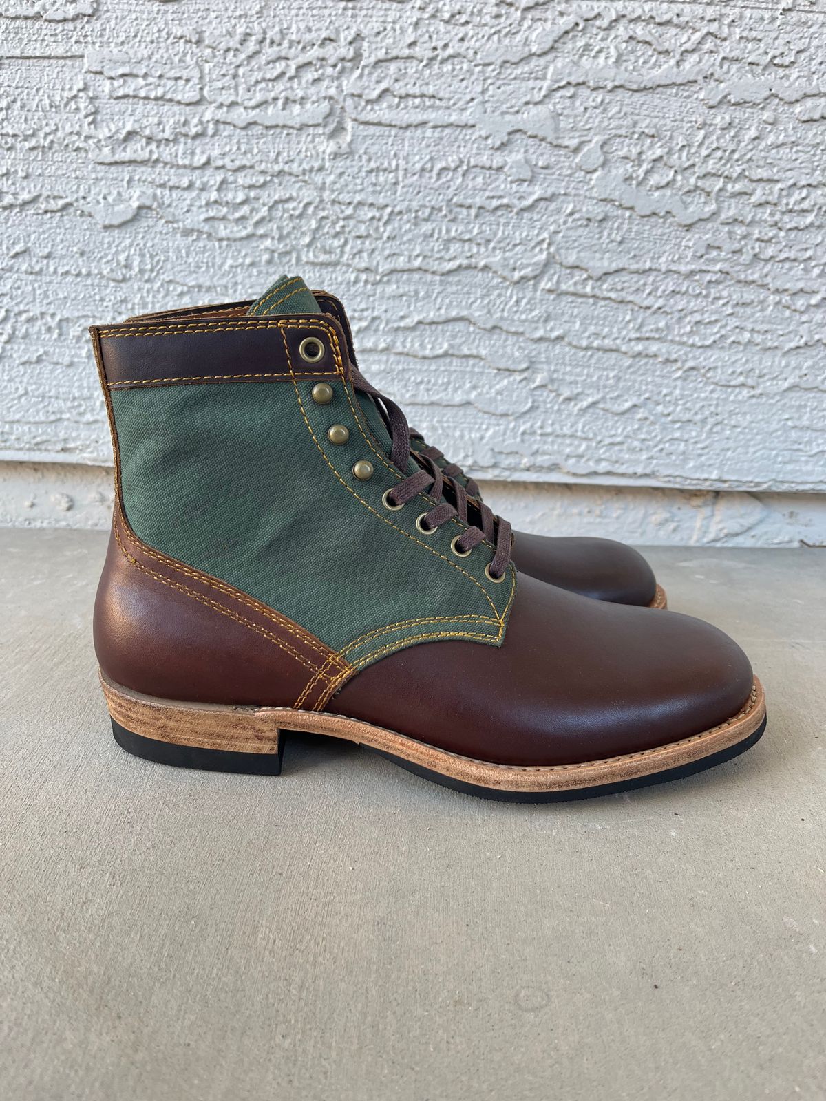 Photo by udi on November 5, 2024 of the Akito Trooper Boots in Veg-tanned, Vintage Brown Hand Finished/12oz Army Green Duck Canvas.