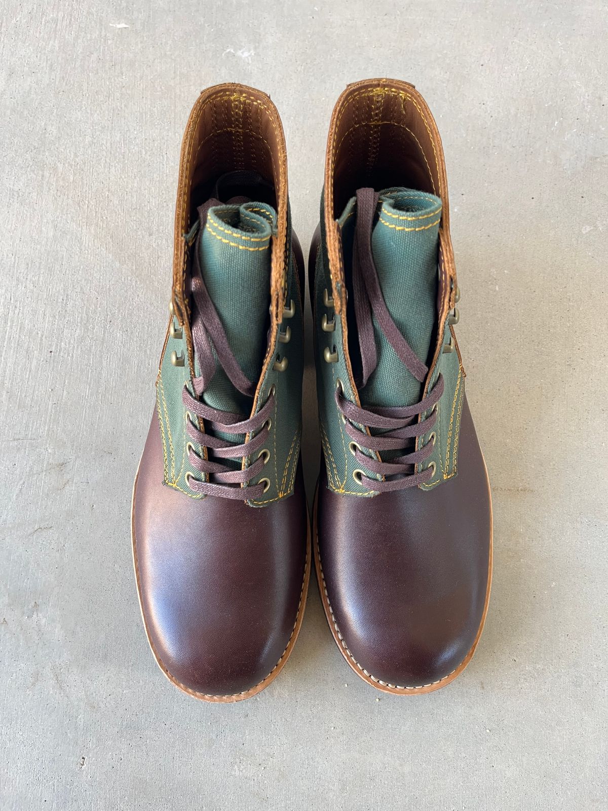 Photo by udi on November 5, 2024 of the Akito Trooper Boots in Veg-tanned, Vintage Brown Hand Finished/12oz Army Green Duck Canvas.