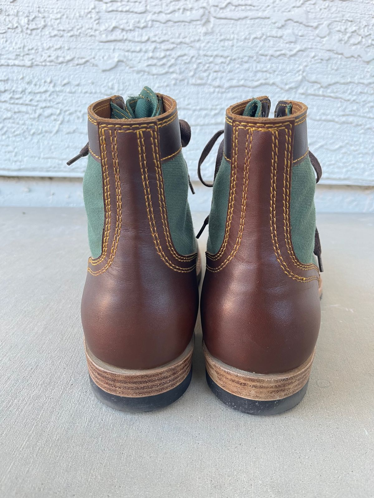 Photo by udi on December 4, 2024 of the Akito Trooper Boots in Veg-tanned, Vintage Brown Hand Finished/12oz Army Green Duck Canvas.