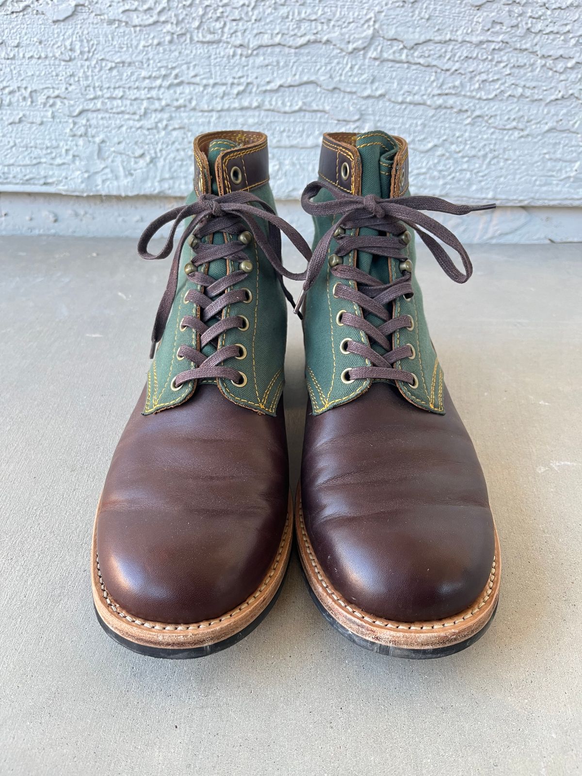 Photo by udi on December 4, 2024 of the Akito Trooper Boots in Veg-tanned, Vintage Brown Hand Finished/12oz Army Green Duck Canvas.