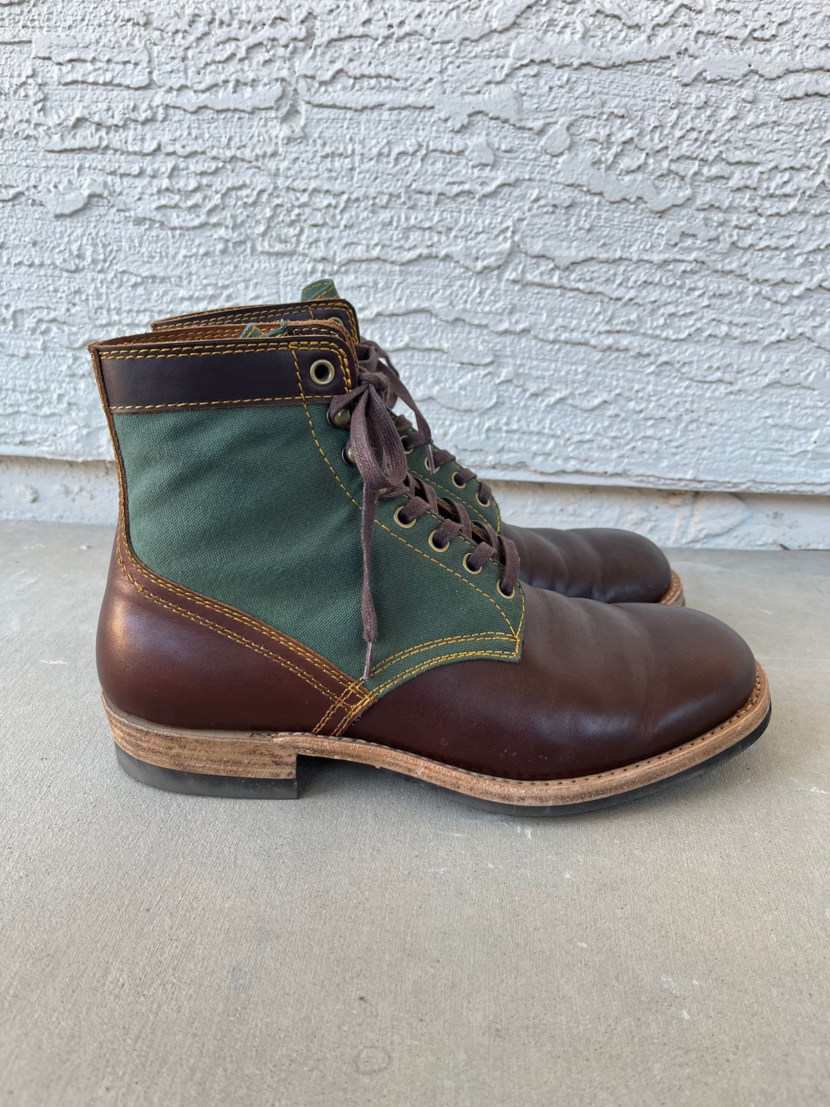 Photo by udi on December 4, 2024 of the Akito Trooper Boots in Veg-tanned, Vintage Brown Hand Finished/12oz Army Green Duck Canvas.