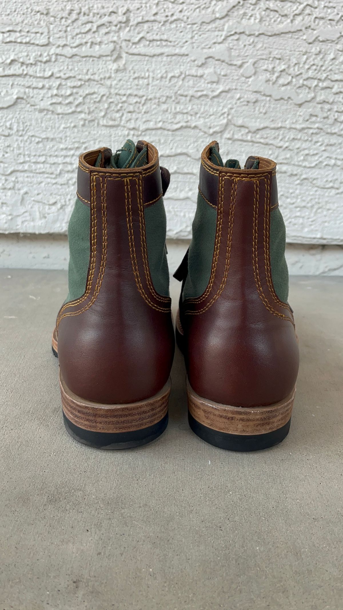 Photo by udi on January 6, 2025 of the Akito Trooper Boots in Veg-tanned, Vintage Brown Hand Finished/12oz Army Green Duck Canvas.