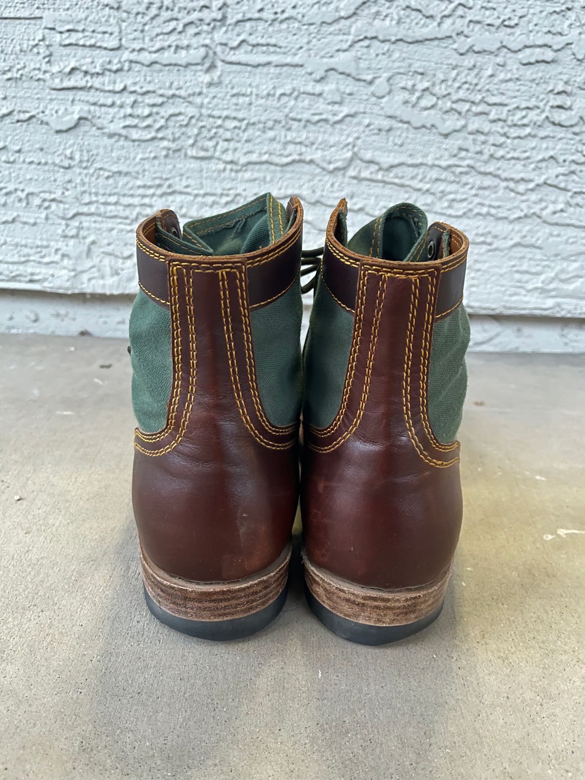 Photo by udi on March 6, 2025 of the Akito Trooper Boots in Veg-tanned, Vintage Brown Hand Finished/12oz Army Green Duck Canvas.