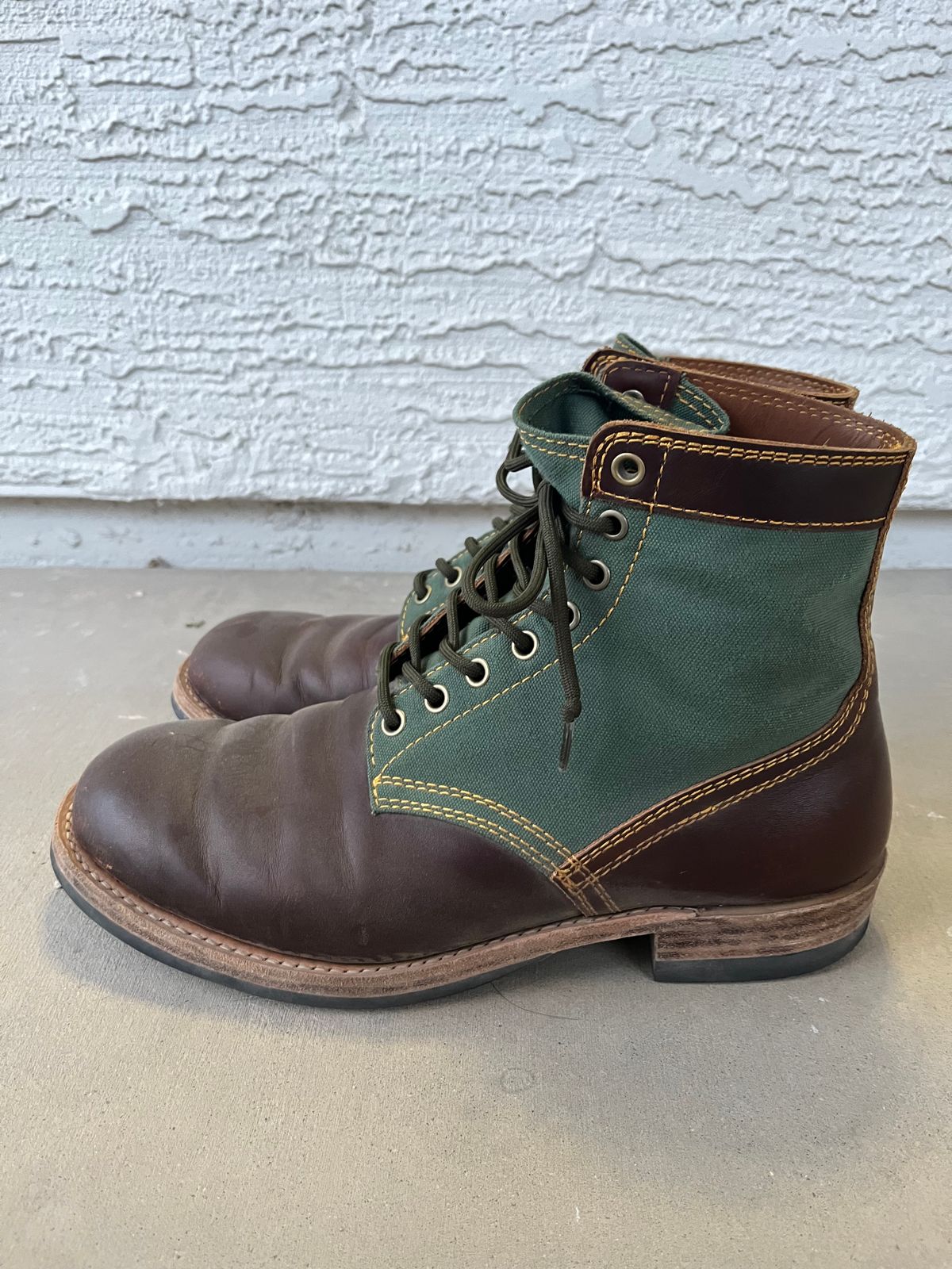 Photo by udi on March 6, 2025 of the Akito Trooper Boots in Veg-tanned, Vintage Brown Hand Finished/12oz Army Green Duck Canvas.