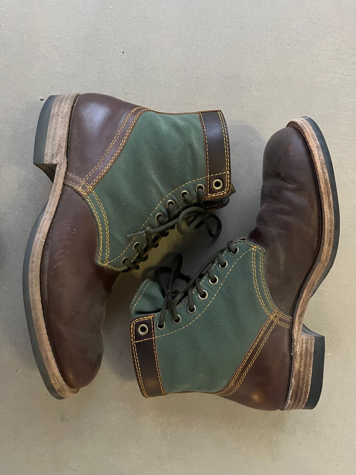 Photo by udi on March 6, 2025 of the Akito Trooper Boots in Veg-tanned, Vintage Brown Hand Finished/12oz Army Green Duck Canvas.