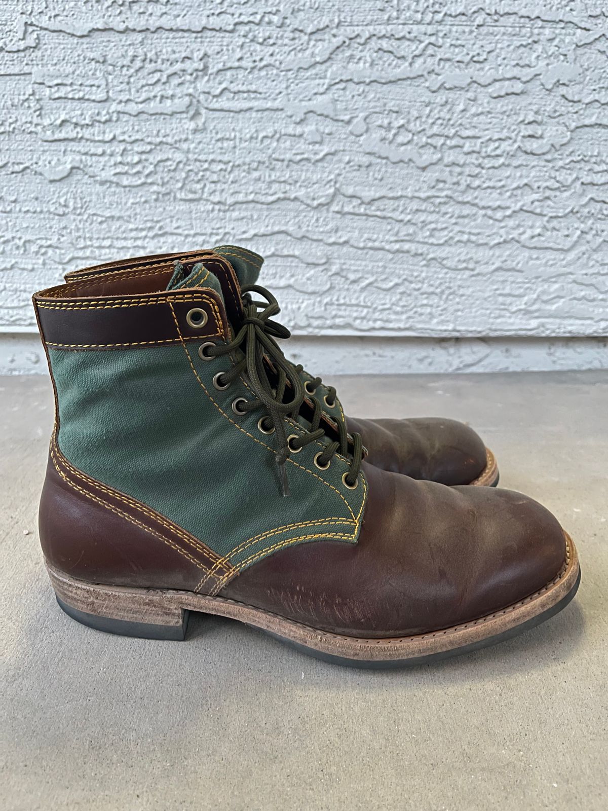 Photo by udi on March 6, 2025 of the Akito Trooper Boots in Veg-tanned, Vintage Brown Hand Finished/12oz Army Green Duck Canvas.