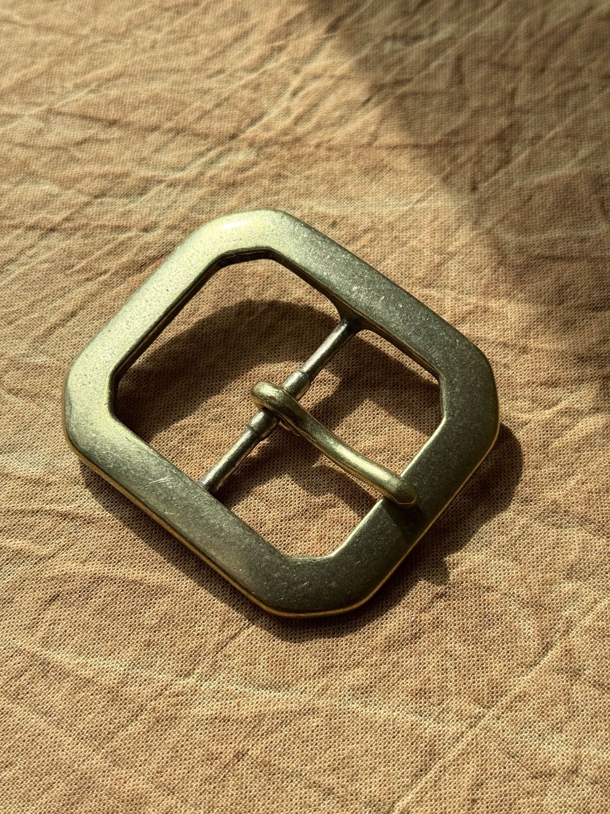 Photo by tlmader on September 4, 2025 of the Titletown Goods Garrison Belt in J&FJ Baker Natural Cross Hatch Bridle.