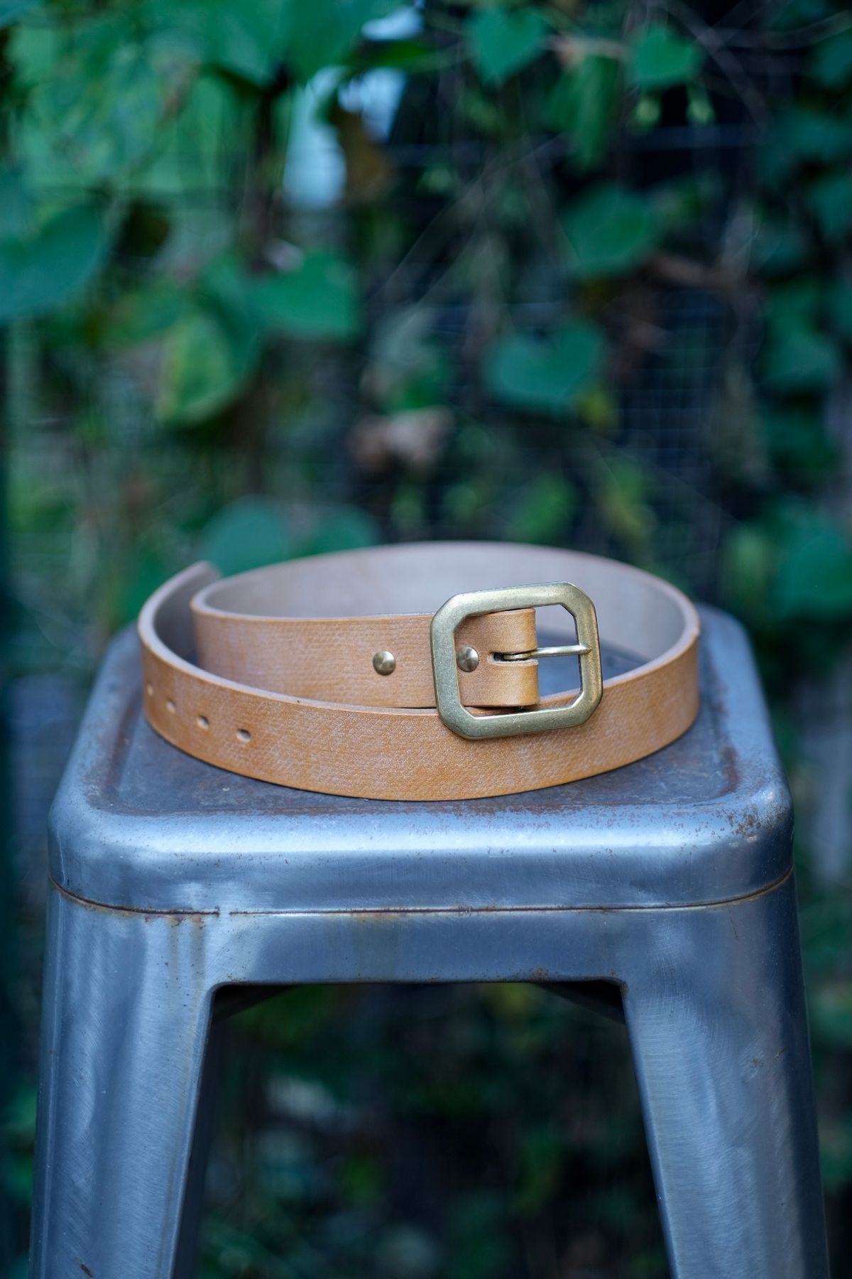 Photo by tlmader on October 1, 2025 of the Titletown Goods Garrison Belt in J&FJ Baker Natural Cross Hatch Bridle.