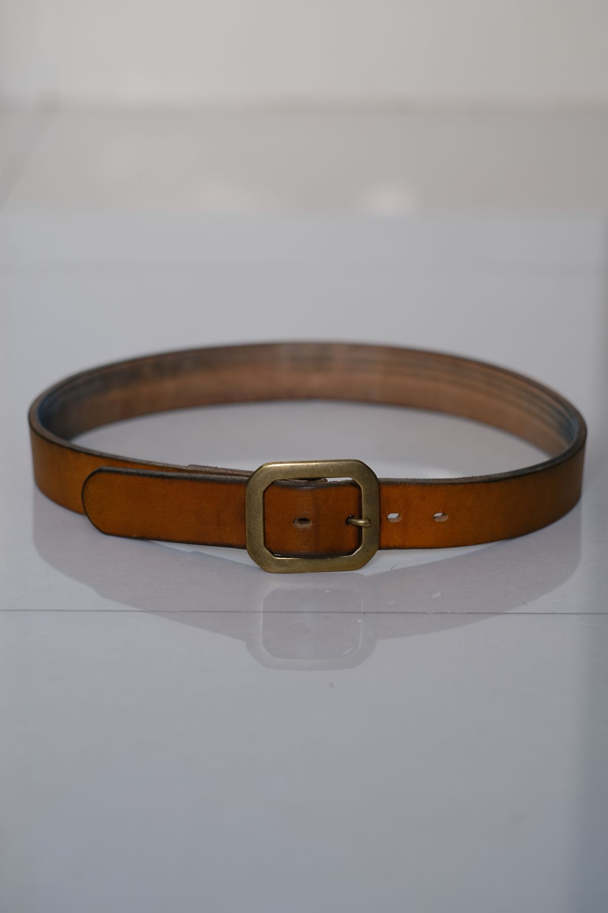 Photo by tlmader on February 2, 2026 of the Titletown Goods Garrison Belt in J&FJ Baker Natural Cross Hatch Bridle.