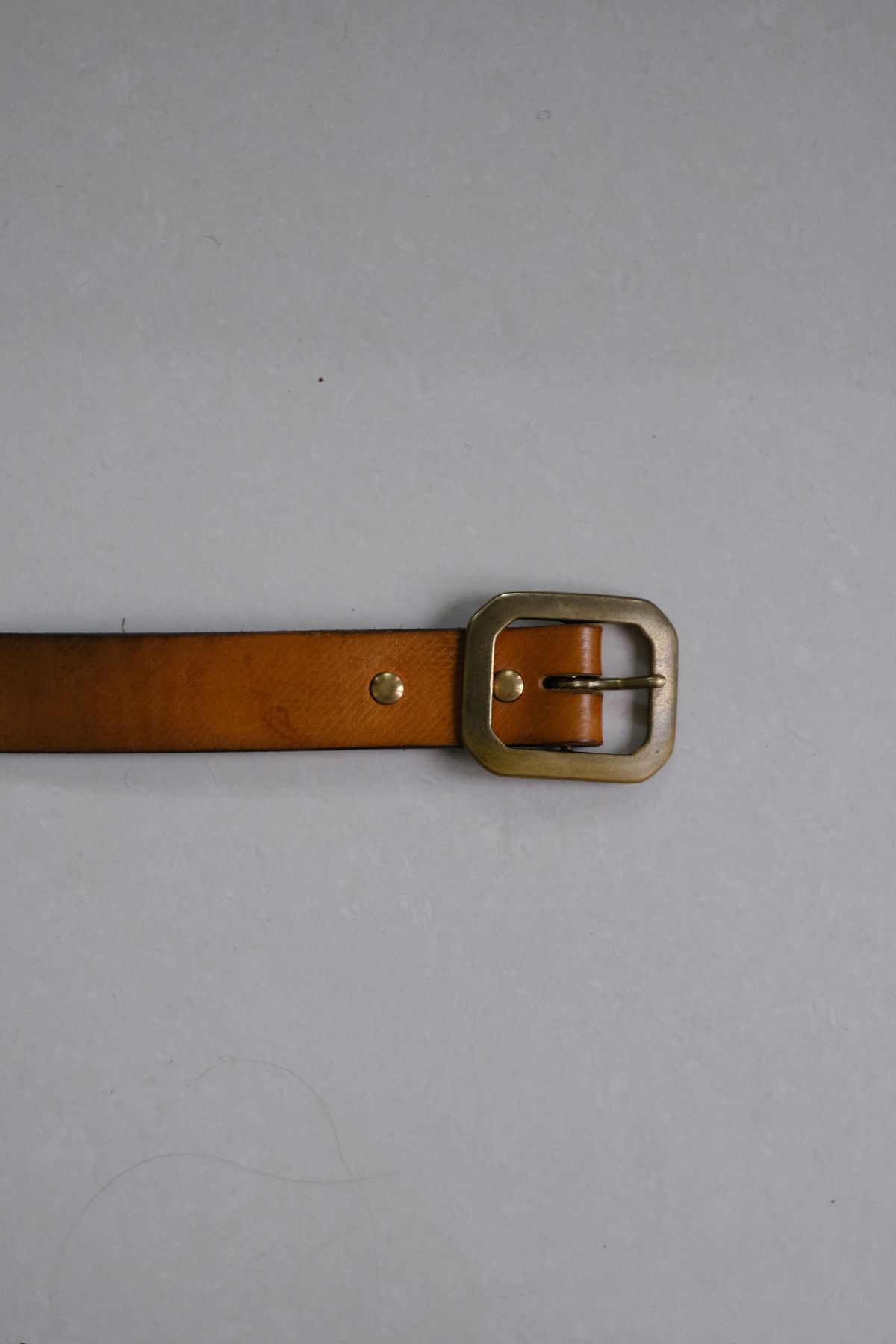 Photo by tlmader on March 6, 2026 of the Titletown Goods Garrison Belt in J&FJ Baker Natural Cross Hatch Bridle.