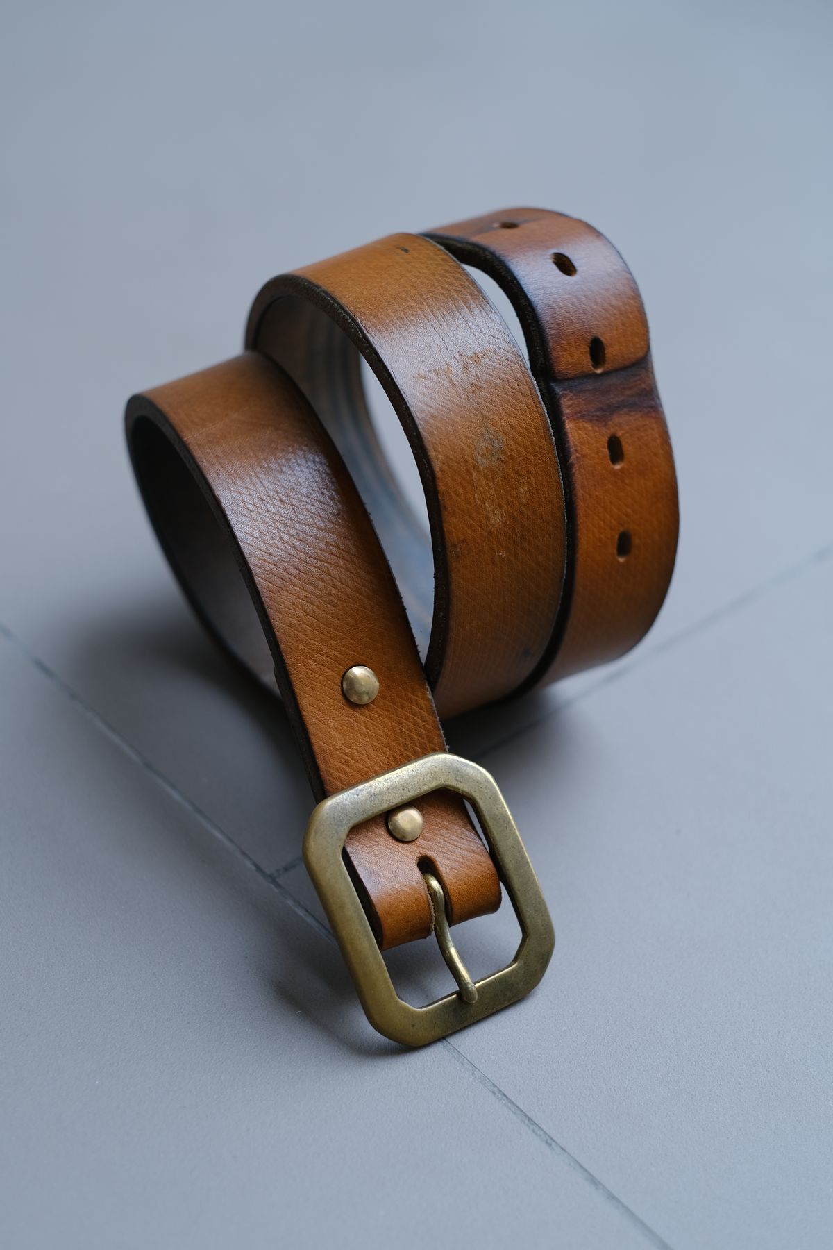 Photo by tlmader on April 6, 2026 of the Titletown Goods Garrison Belt in J&FJ Baker Natural Cross Hatch Bridle.