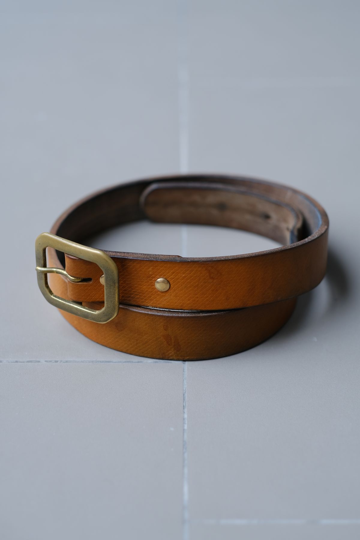 Photo by tlmader on April 6, 2026 of the Titletown Goods Garrison Belt in J&FJ Baker Natural Cross Hatch Bridle.