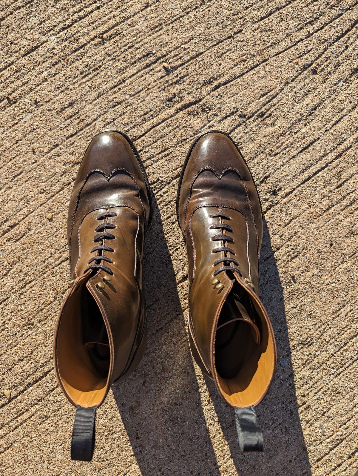 Photo by Ali_LegacyBootworks on November 9, 2023 of the Tread Heavily Shoes Acclamator Austerity Brogue Boot in Horween Dark Cognac Shell Cordovan.