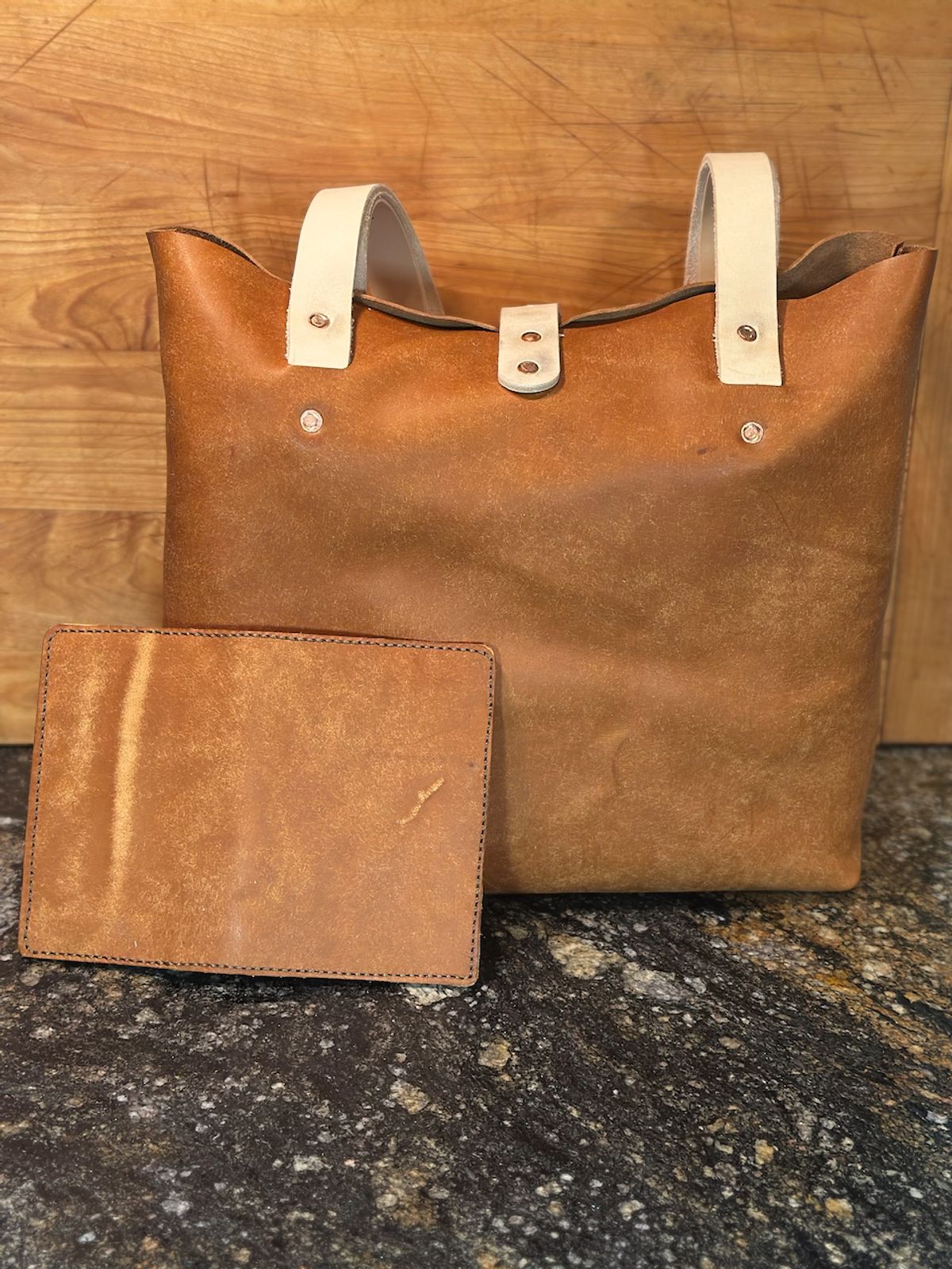 Photo by cows_electronico on October 5, 2025 of the Swampoodle Homemade Goods Tote Bag and Field Notes Cover Combo in Conceria Walpier Natural Mud Rustic Vachetta & Supernatural Natural Veg Tan.
