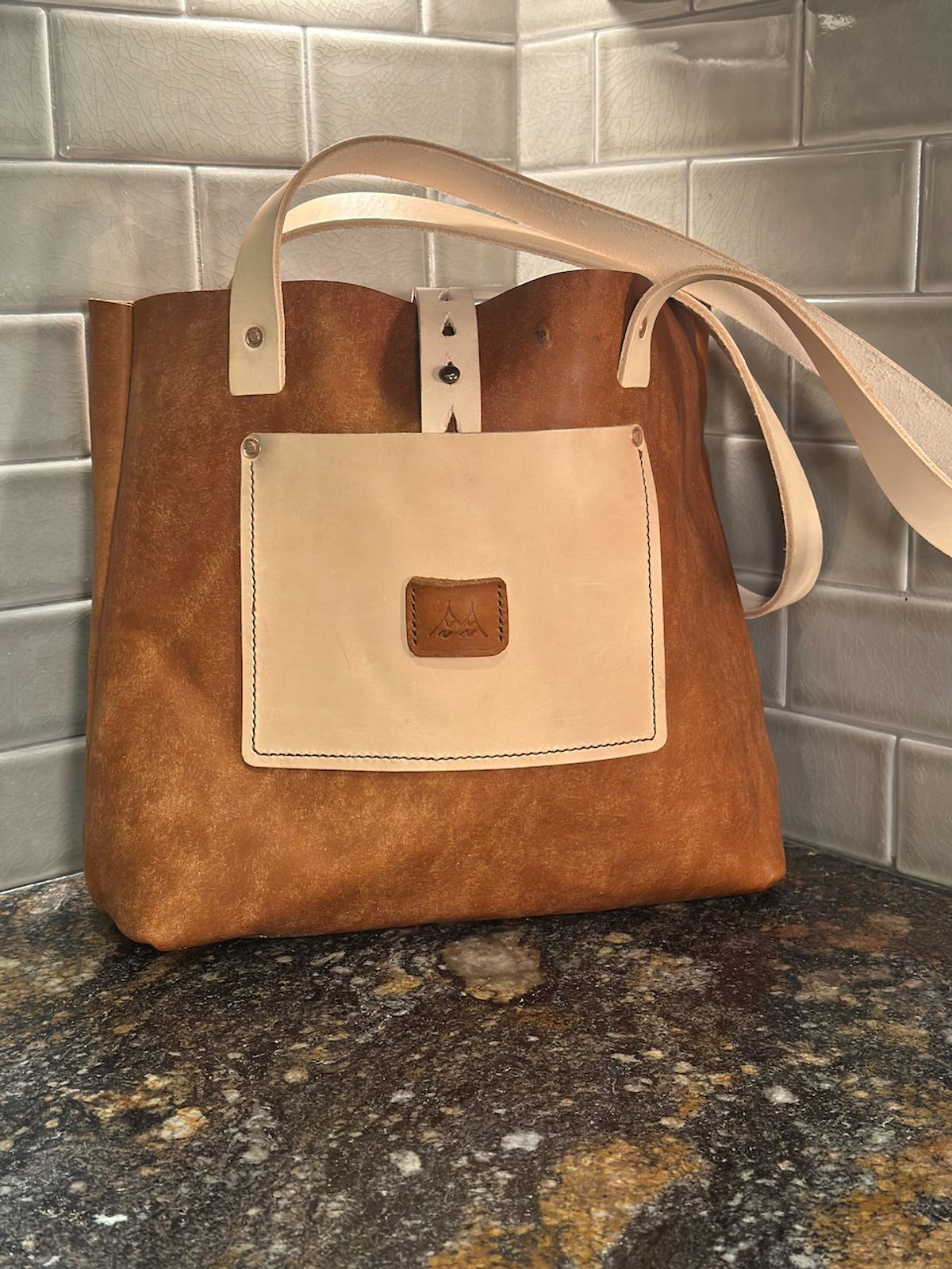 Photo by cows_electronico on October 5, 2025 of the Swampoodle Homemade Goods Tote Bag and Field Notes Cover Combo in Conceria Walpier Natural Mud Rustic Vachetta & Supernatural Natural Veg Tan.
