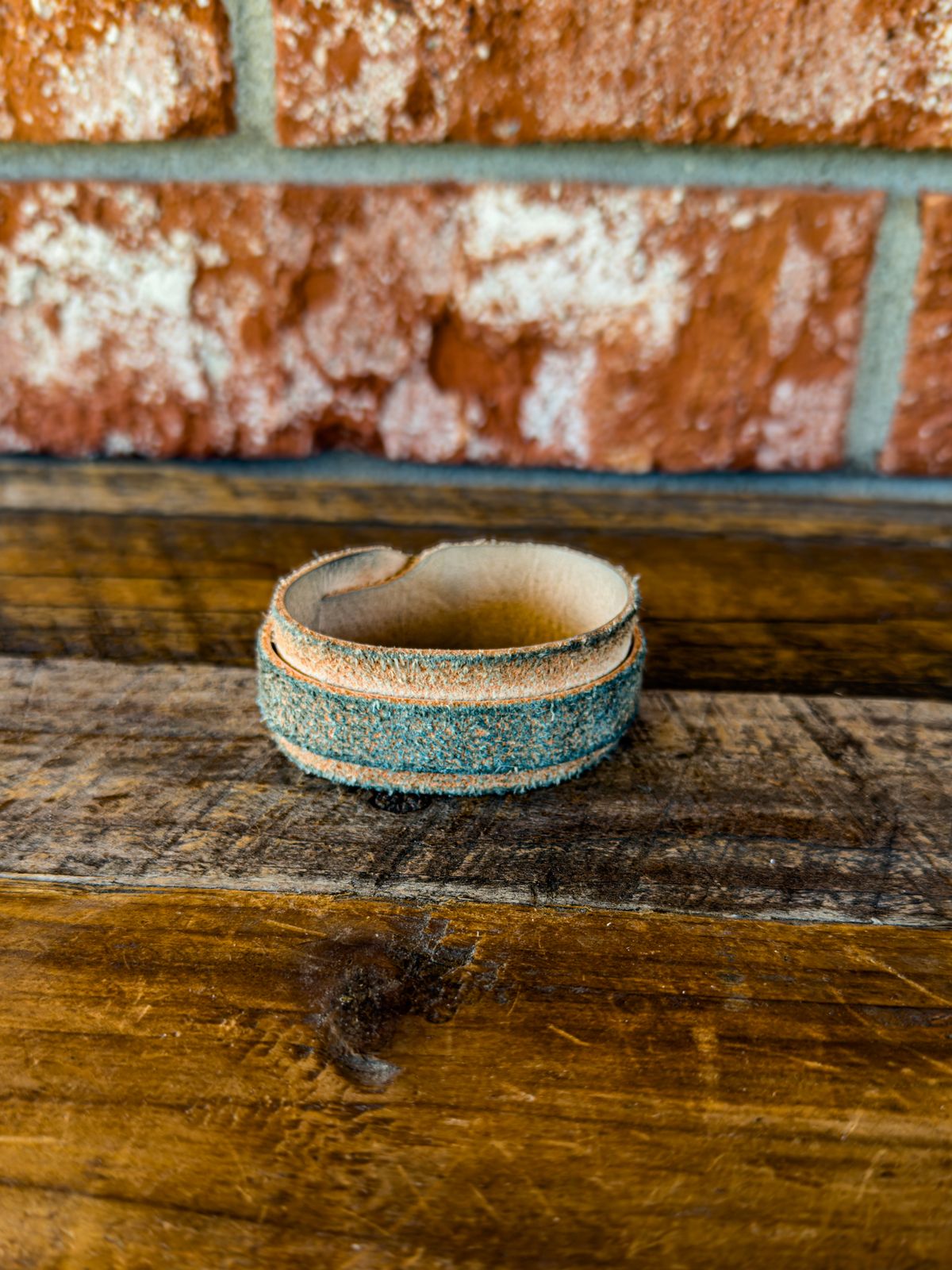 Photo by KVanDev on October 31, 2025 of the Harker Leatherworks Leather cuff in Unknown Natural Veg Tan Roughout.