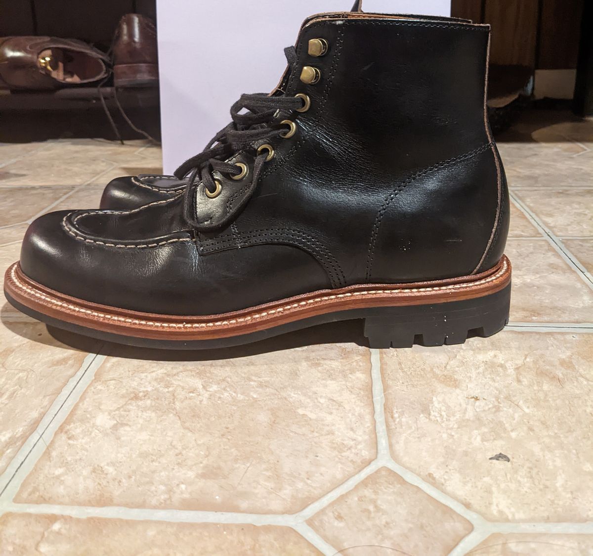Photo by withinthenebula on October 6, 2022 of the Grant Stone Brass Boot in Horween Black Chromexcel.