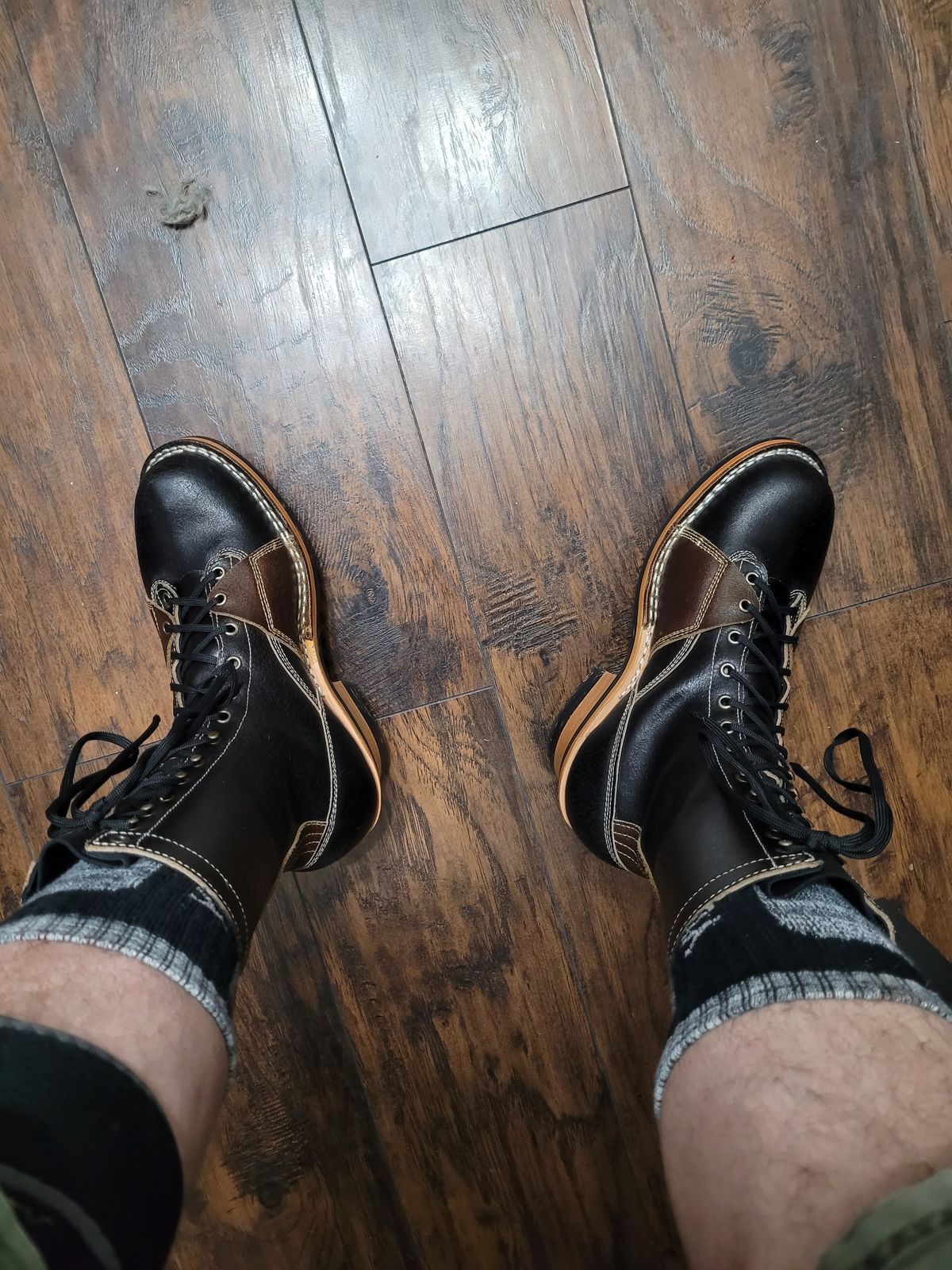 Photo by Schmittworks on September 23, 2024 of the Frank's Boots Lace-To-Toe in Horween Black Waxed Flesh & Horween Cinnamon Waxed Flesh.