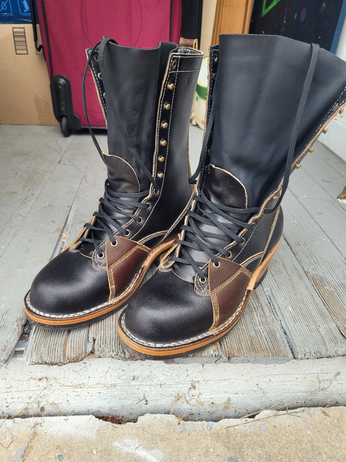 Photo by Schmittworks on September 24, 2024 of the Frank's Boots Lace-To-Toe in Horween Black Waxed Flesh & Horween Cinnamon Waxed Flesh.