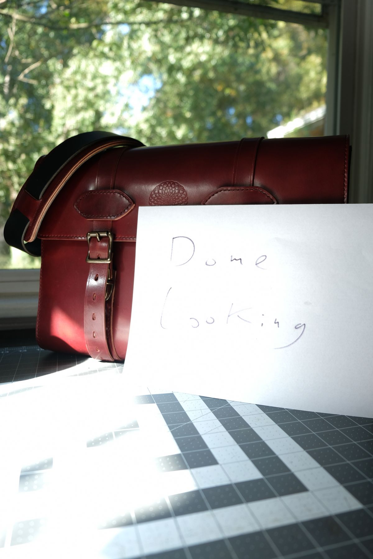 Photo by morosoleatherworks on November 5, 2025 of the Moroso Leatherworks Messenger Bag in Wickett & Craig Burgundy Burnt Harness & Wickett & Craig Black Milled Traditional Harness.