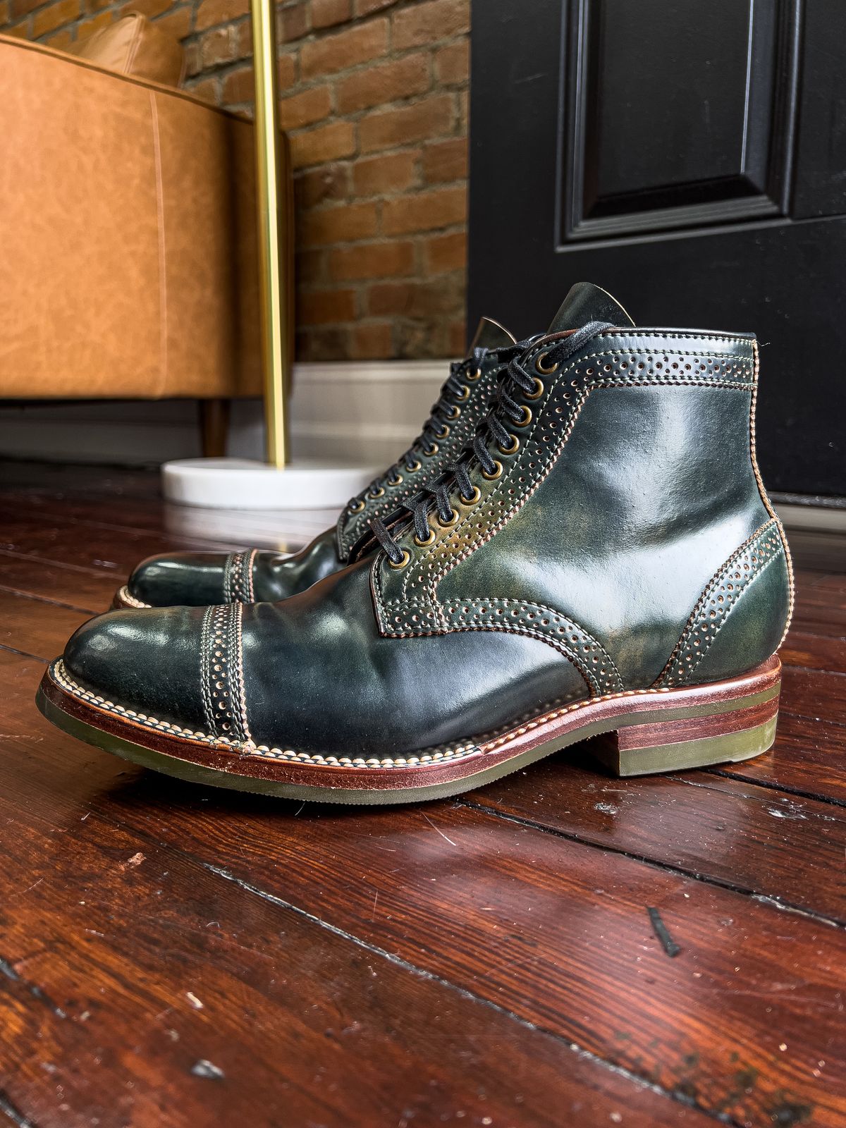 Photo by weathered.hide on November 5, 2022 of the Flame Panda Brogue Cap Toe Service Boot in Horween Marbled Black Shell Cordovan.