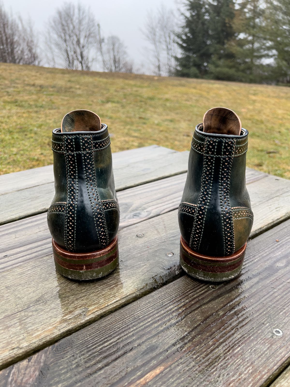 Photo by weathered.hide on January 6, 2023 of the Flame Panda Brogue Cap Toe Service Boot in Horween Marbled Black Shell Cordovan.