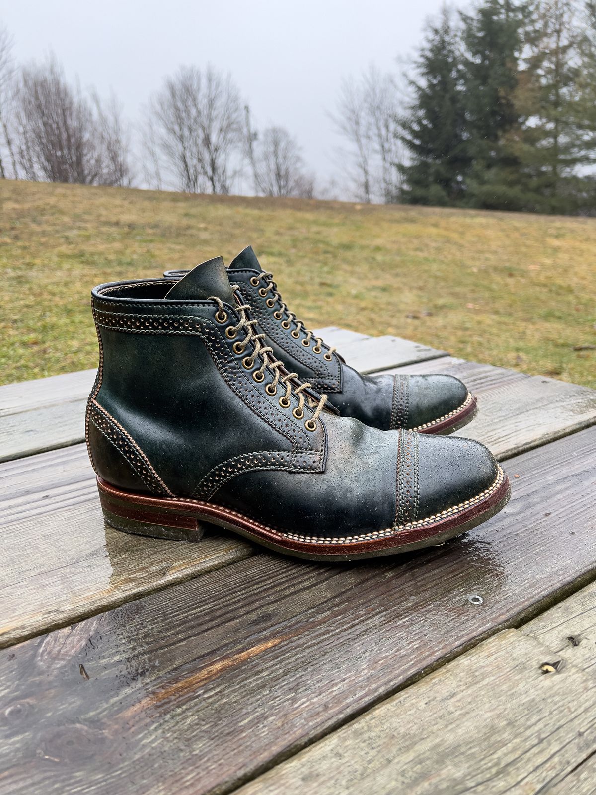 Photo by weathered.hide on January 6, 2023 of the Flame Panda Brogue Cap Toe Service Boot in Horween Marbled Black Shell Cordovan.